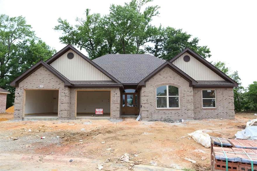 Hurry while there's still time to pick your paint colors!! A fantastic split 3 BDR/2 Bath open floor plan all brick new home! Kitchen w/custom cabinets, large walkin pantry, granite countertops, breakfast bar that overlooks living room that has tray ceiling and gas log fireplace, MBath has whirlpool tub, tile shower, 2 walk-in closets. Large laundry room with extra storage room as well. Hardwoods in main areas, tile in wet areas & carpet in bedrooms. Great covered back porch as well to enjoy!