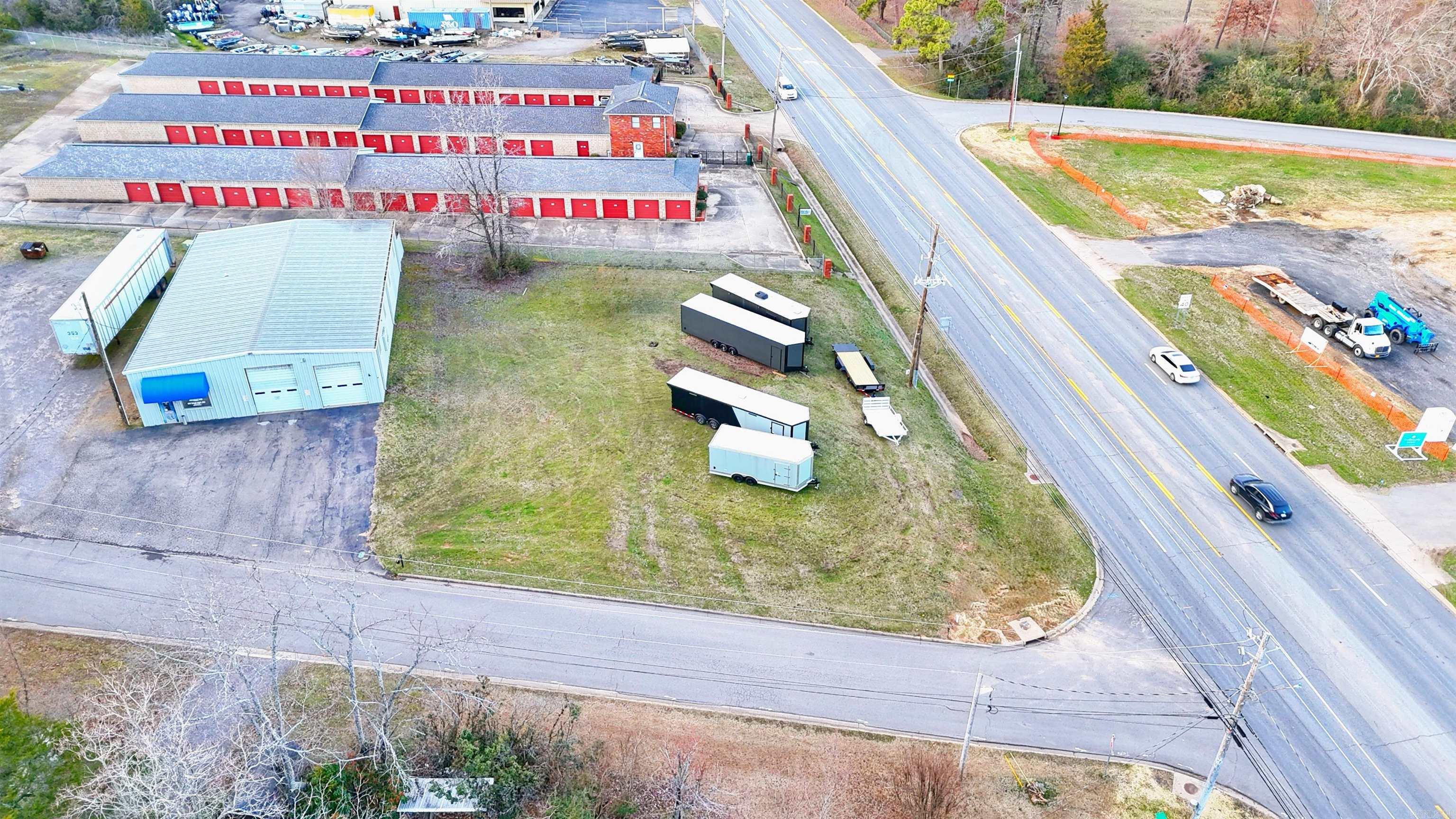 Prominently located C-2 zoned commercial parcel, situated on a high-traffic thoroughfare with approximately 20,000 vehicles passing daily, this property offers unparalleled visibility and exposure. ⢠Strategic Zoning & Surroundings: - Zoned C-2 and surrounded by similarly zoned properties ⢠Booming Area: - Located directly across from a future dentist, law office, and office/shopping center currently under construction ⢠Scenic: - Close to the lake, charming neighborhoods, nearby the prettiest side of town. - Only 5 minutes from all essential amenities. ⢠Convenience: - Approximately a mile from the Interstate 40 on/off ramp, offering easy access for customers and clients. Seize this unique chance to own a highly visible commercial lot in a growing area!