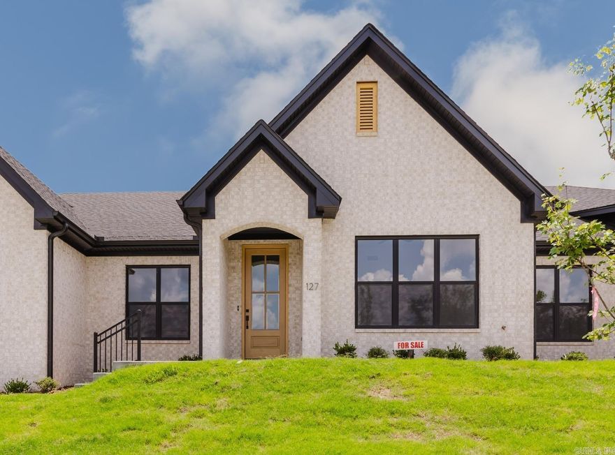 UNDER CONSTRSUCTION! Welcome to Edgewood, West Little Rock's newest destination for luxury living! Nestled among lush landscaping and mature trees, the Edgewood community offers a serene, secluded atmosphere while still being just moments from your favorite shopping and dining spots. One of the best perks? You’ll NEVER MOW YOUR YARD AGAIN—lawn maintenance is included with your yearly fees! This unit features 2 bedrooms and 2 full bathrooms. The fully equipped chef's kitchen includes a walk-in pantry and a central island, opening to a spacious living room with a built-in fireplace. The master suite boasts high vaulted ceilings, a spa-like bathroom with a walk-in shower, and a generous walk-in closet. You'll also enjoy a two-car garage and a large covered back patio accessed from the private drive. Each unit is separated by fire walls and sound cavities, ensuring a soundproof, comfortable living space. Set to be completed September 2026. Pictures depict same floorplan, different finishes.