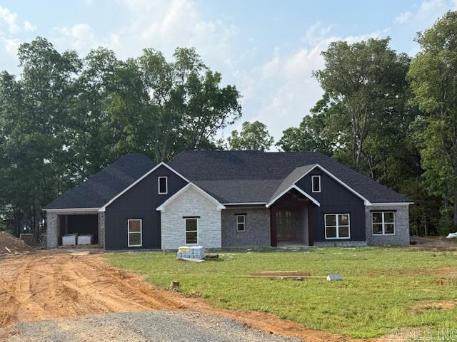 Over one acre Lakefront Lot! Enjoy the views of the lake from the big covered back porch with a vaulted tongue & groove wood ceiling. A large deck will be added for even more outdoor entertaining space. There will be room in this backyard if you wanted to add a pool later. The home is open concept with cabinets in the kitchen to the 10 ft. ceilings. The pantry is huge & will be hidden behind the cabinet doors in the kitchen cabinets. Will have a massive island with the sink in the island. The living room has a vaulted ceiling that carries out to the back porch. You will love the windows with the views of the lake. The laundry is oversized with lots of cabinets. From the laundry room you can enter the primary closet with more room than you will have clothes for. From the closet you can enter the primary bathroom. Separate tile shower & soaking tub and dual vanities. Primary bedroom is separate from the 3 guest bedrooms. Luxury vinyl flooring throughout. Lockers as you come in from the garage. The 3rd bay of the garage is extra deep (35 feet) to stow all of your lake toys and your boat. There is also room on this lot to build a shop. This subdivision is brand new. All new homes here