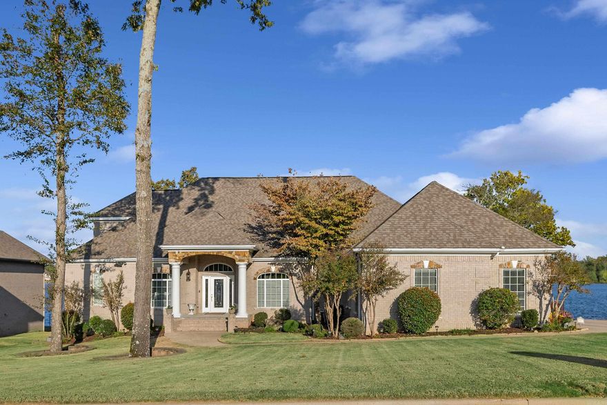 WATER VIEWS IN HURRICANE LAKE! This stunning home features lake views from almost every room that will take your breath away. A private chefs kitchen includes a gas range, double ovens, cherry wood cabinets, and opens to a cozy hearth room with a gas fireplace. The primary suite boasts a private fireplace, a spa-like master bath with a double vanity, and a spacious walk-in closet. Located on the main level, youāll find an additional primary suite, while the home also boasts formal living and dining rooms. Not one but TWO sunrooms perfect for having that morning cup of coffee in peace and enjoying that incredible view. Bonus rooms include a theater room, game room, craft room, spacious office with a kitchen, and a workshop area beneath the home. Outside, the large deck is perfect for entertaining, overlooking the flat, fenced backyard with a retaining wall, wrought iron fence, and private boat slip. This home is a gem!