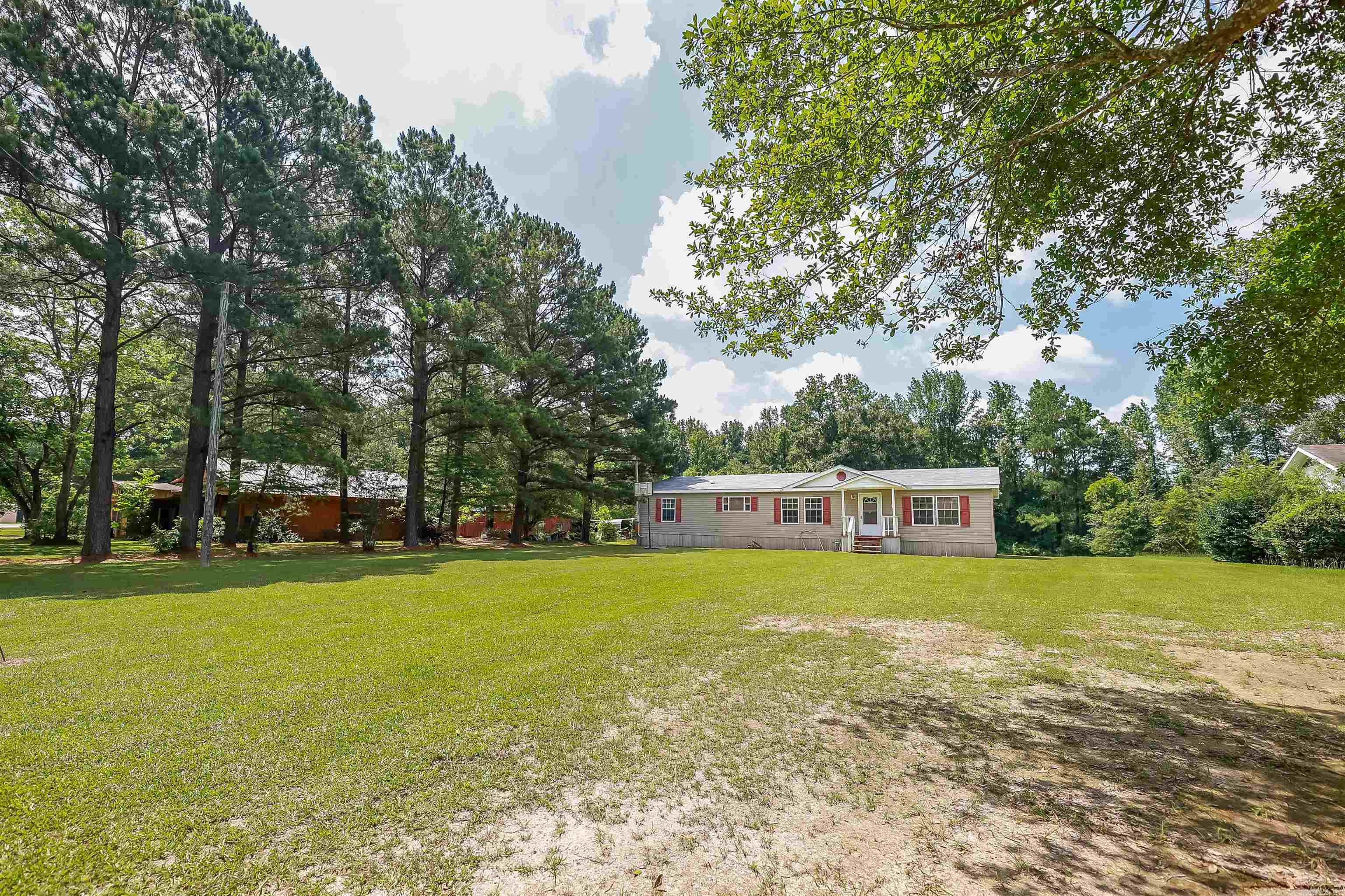 Spacious 3 bedroom, 2 bathroom home on a 0.71 acre lot. Amazing layout. Large bedrooms. Fantastic primary suite with a large closet. Best of all? A brand new deck in the back, perfect for enjoying these South Arkansas summers.