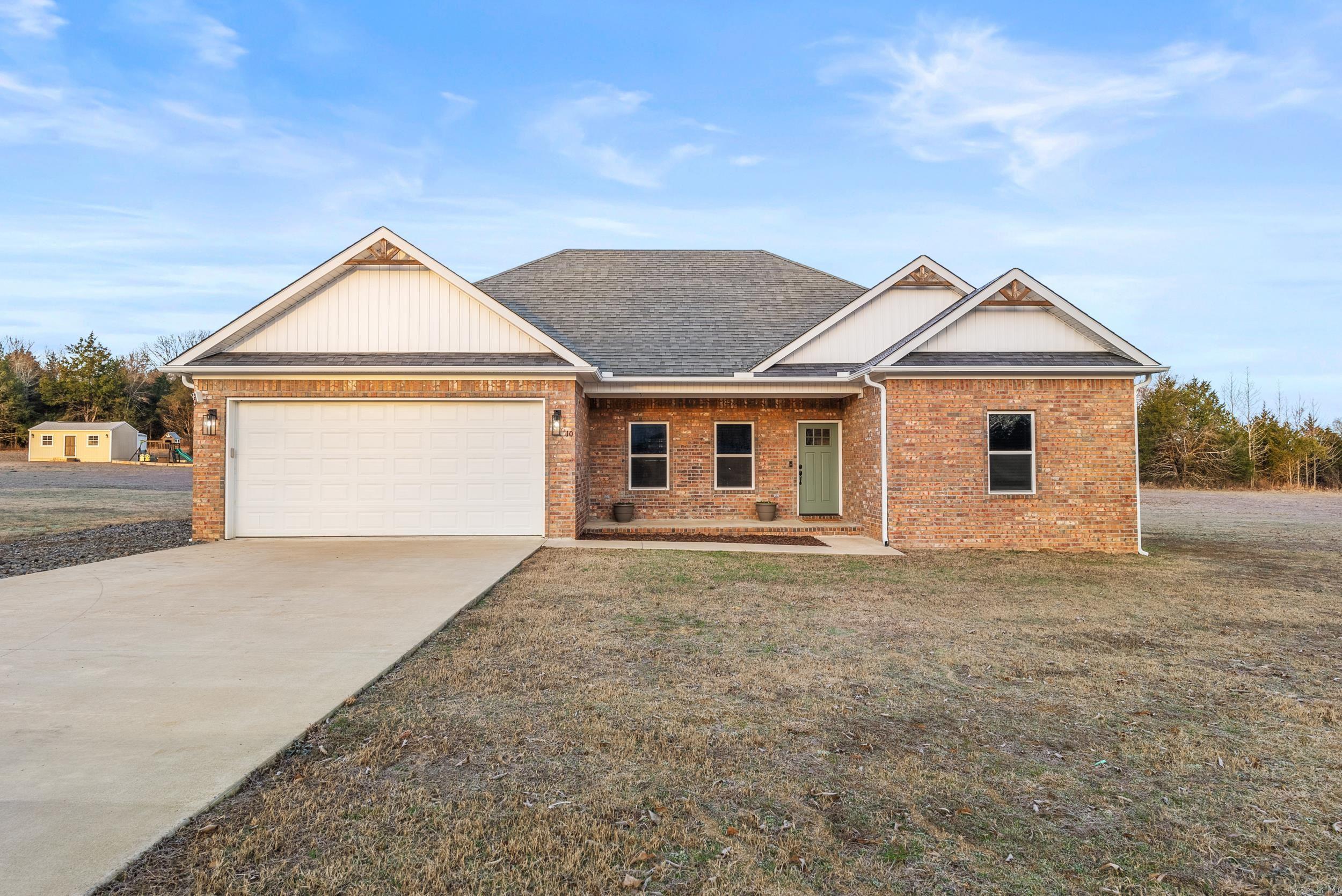Gorgeous 4 bed, 2 bath home sitting on a full acre in the highly sought after Greenbrier School District! This stunning 2022 built, all-electric beauty offers the best of modern living with an open floor plan, gleaming granite countertops, and durable LVP flooring throughout. The split bedroom layout provides privacy, while the spacious master suite features a luxurious tiled shower. Outside, you'll find plenty of space to stretch out, plus a gravel parking pad alongside the driveway-perfect for extra vehicles. This home is a rare find that will not last long! AGENTS PLEASE SEE REMARKS