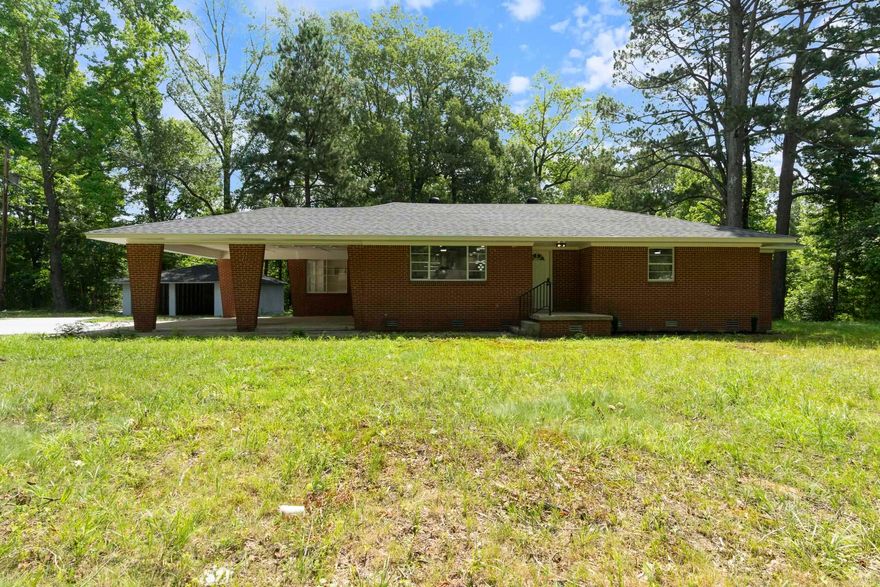 This stunning brick home is situated on 1.49 acres, offering the perfect blend of space and modern style. With four spacious bedrooms, three bathrooms, and an open layout, you'll enjoy a bright and functional living space. Recent upgrades include a new roof, new electricity, new plumbing, city sewer system, HVAC system, tankless water heater, updated flooring, and lighting, plus a freshly poured driveway.  The kitchen and bathrooms boast updated finishes, giving the home a clean and refreshed vibe. You'll appreciate the large laundry room and private primary suite, perfect for relaxing after a long day. Outside, the level lot provides plenty of room for outdoor activities or future projects, all within a peaceful setting just minutes from nearby city conveniences. Call today for your tour of this beautiful property!