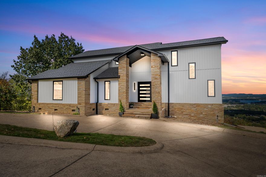 Nestled on Mt Riante, this exceptional property offers over 2700 square feet of modern living space, along with an additional 1000 square feet, consisting of the heated/cooled garage/workshop, theatre room, 4th bedroom, and/or game room, perfect for entertainment or extended comfort. Recently updated, the home features new custom cabinets and appliances, new siding, a durable new roof, energy-efficient windows, and fresh paint throughout. New flooring enhances the sleep interior, while extensive outdoor lighting showcases the property and includes a tranquil water feature. What truly sets this property apart from all the rest is it's panoramic view. As one of only 17 properties with this vantage point, you will enjoy stunning vistas that sweep across the entire valley, including the area lakes. This unique perspective creates an unrivaled atmosphere of serenity and beauty, making this home an extraordinary find.