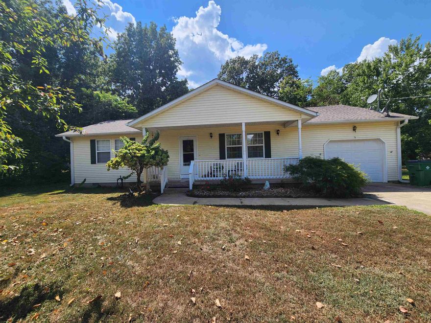 Stunning home with 3 attached lots. This very well-maintained home is a showcase home from the open floorplan kitchen dining and living area with vaulted ceilings to the large primary bedroom with en-suite 1/2 bath, sitting area and walk in closet. The huge Sunroom is presently used for formal dining/coffee and breakfast bar as well as secondary den and library and it has its own heating and cooling. The large back patio/deck is covered and is like a sanctuary away from the public. The backyard has 2 outbuildings (She-Shed and doghouse/shop? your choice.) The back yard is fully fenced. Lots of landscaping, flowers, trees and shrubs from the covered front porch to the back yard. There is a large one car garage with a storm shelter inside. Plenty of extra room to build a shop or garage on the 2 extra lots. No immediate neighbors. This home is a must-see property. Schedule an appointment to see this one today.