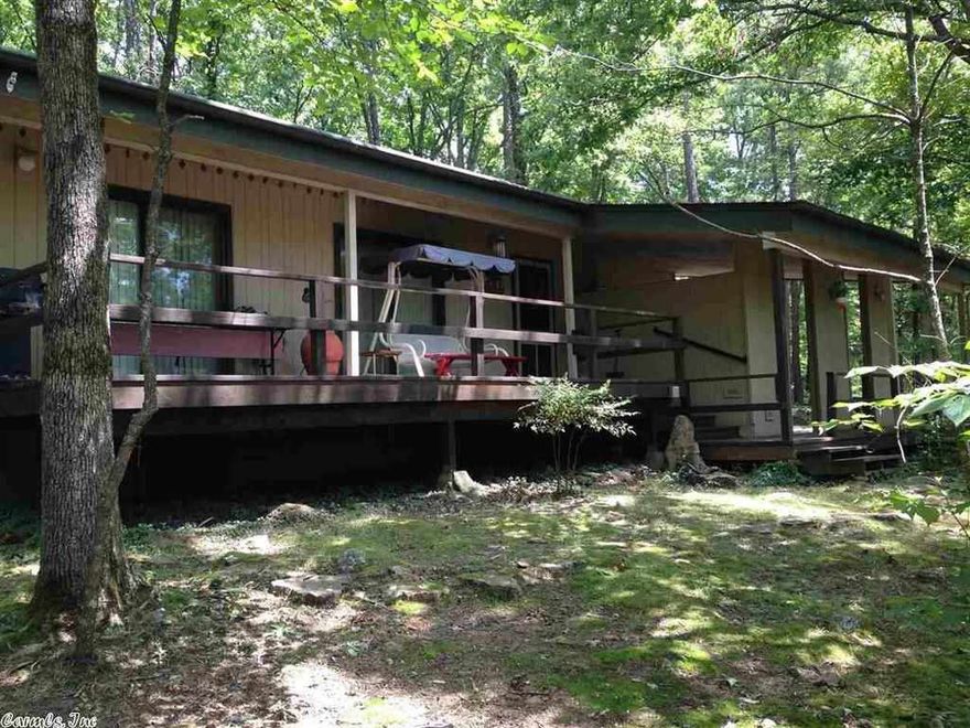 Adorable cabin nestled in the trees of this secluded 2 lots.  Only a minute from the golf course and club house.  Enjoy the peace and quite and experience wildlife outside your backdoor. See agent remarks for show information.