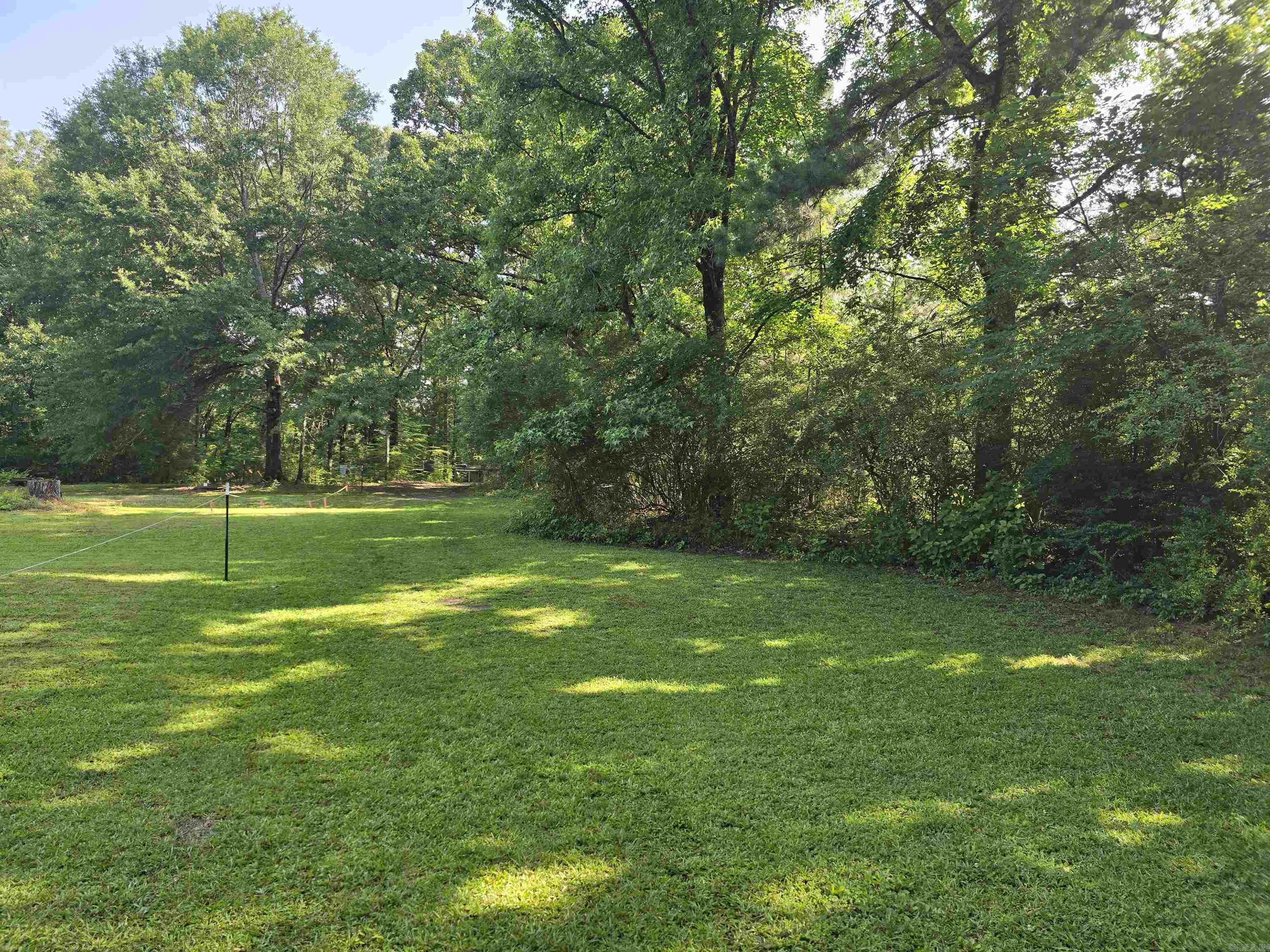 Lot in country setting, mobile to convey at no a value.