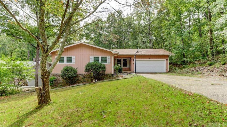 Beautiful 4 Bedroom Home in Hot Springs Village!! Main level features a master bed & en suite with a home office as well as two bedrooms, one full bath, and one half bath. The Downstairs features a second living area with a half bath & bedroom complete with a kitchenette and lots of storage! Very quiet neighborhood and just a short walk away from Desoto Beach on Lake Desoto! Make this beautiful house your home today!