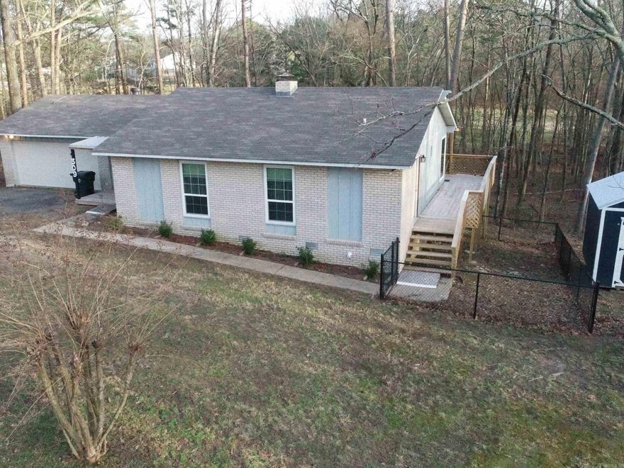 Step into this newly remodeled piece of paradise.  Walls have ben removed to add an open main living area.  Master bath room has been moved and has upgrades that give a spa like feel.  HUGE walk in master closet was also added.  The deck has been replaced and a fenced area is perfect for pets and small children was added.  New storage building and new appliances are part of its value.  This could be a S-T-R With the many amenities Diamondhead has to offer.