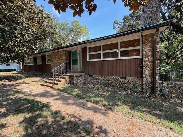Spacious Stone Home on Crowley’s Ridge! Nestled on 3 partially wooded acres, this 4-bedroom, 2-bath home offers the perfect balance of privacy and potential. Inside, you’ll find multiple living areas and plenty of opportunity for cosmetic updates to quickly build equity. Enjoy relaxing or entertaining on the large screened-in porch overlooking the private, wooded setting. A partial basement provides bonus space and doubles as a storm shelter. The expansive lot offers room to play, garden, or host gatherings. Priced right for the space and location—don’t miss this opportunity! Call today!
