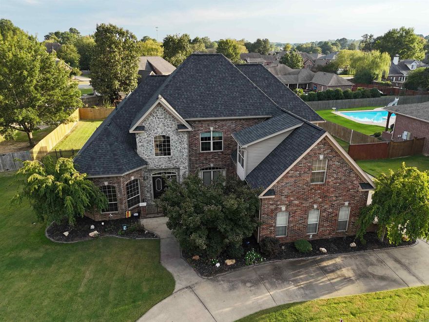 20 foot ceilings greet you in this very well kept Westpointe home. A suspended catwalk overlooking a high stone fireplace. Large open kitchen with granite island includes a separate Hearth room with additional FP and wet bar for ultimate entertaining. Master suite with large private bath also connects to the office through double French doors. Two additional private ensuites upstairs with flex space that can be 4th bedroom or bonus room.  2 water heaters, 3 HVACs, irrigation system, and an underground storm shelter to meet all your needs. Bryant Schools (Seller is a Licensed RE Agent)