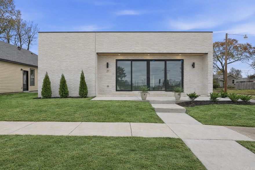 Clean lines still matter. So does how a place makes you feel.  Set in the revitalizing neighborhood of Hanger Hill, this modern new-construction home is where thoughtful architecture meets everyday ease. The crisp brick exterior, flat-roof profile, and expansive glass create a confident first impression—but it’s the sense of calm and intention that really sets it apart.  Inside, natural light fills open, efficient spaces finished with clean, modern materials chosen for both beauty and longevity. Every detail feels purposeful—easy to maintain, energy-conscious, and built to support real life while still feeling elevated.  And then there’s the lifestyle. Minutes from downtown Little Rock and just steps from the energy of East Village, your weekends can unfold with a walk to Southern Tail Brewing or Lost Forty Brewing, an evening at the new Arkansas Symphony Orchestra, or a casual wander through Pettaway and SoMa.  Modern new construction at this price point is rare in Little Rock. This isn’t just a smart buy—it’s an invitation to live close to what’s happening, in a space that feels grounded, intentional, and entirely your own. Don't miss this unique opportunity!