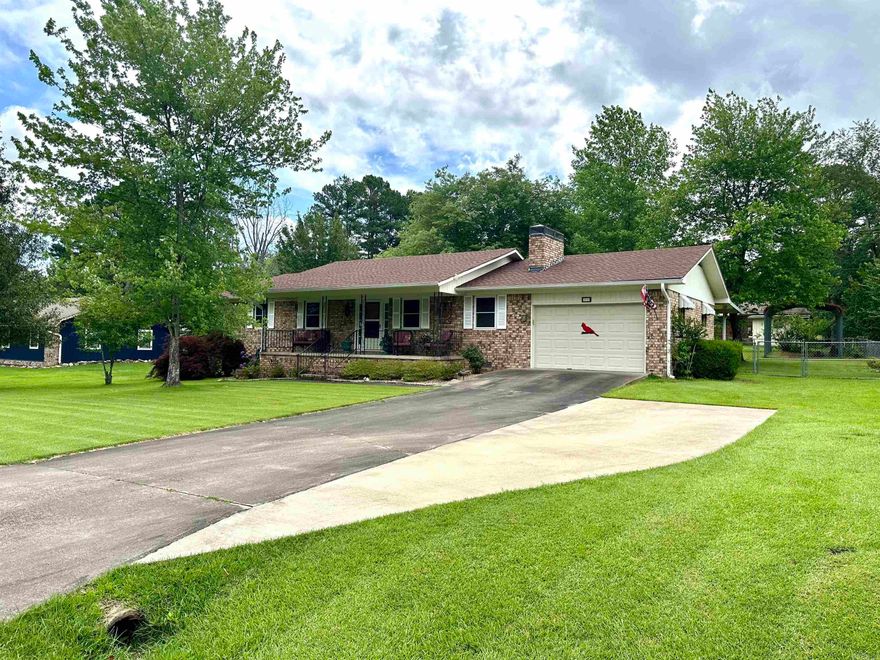 Take a look at this beautiful home, situated in Heber Springs within walking distance to Greers Ferry Lake and a country club/golf course! This 1371 sq ft home offers a spacious primary suite with a large walk in closet. Seller has made several updates, including a new roof, guttering, flooring, appliances, ac unit, hot water heater, just to name a few! The yard is immaculate with mature hardwood trees and a great covered patio/porch for entertaining, the backyard is completely fenced and has 2 outbuildings for storage, a cover for a RV, and a nice storm cellar. This home has been well-cared for and is move-in ready.