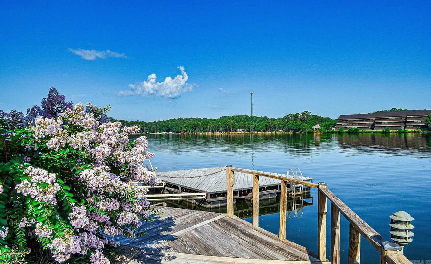 Stunning Lakefront Condo – Fully Renovated and Move-In Ready! Welcome to your dream retreat on the shores of Lake Hamilton that is selling fully furnished! This beautifully renovated ground-level condo offers breathtaking lake views and the ultimate in convenience and comfort. Step inside to discover a modern, open-concept living space that has been completely transformed with brand-new finishes. The interior features sleek flooring, fresh paint, and contemporary fixtures throughout. The spacious living area is perfect for relaxation or entertaining, while the fully equipped kitchen boasts brand-new appliances, stylish countertops, and ample storage. Enjoy your morning coffee or evening sunsets on your private patio, with direct access to the serene beauty of the lake just steps away. Located in the desirable Lake Hamilton School District, this condo is not only a perfect getaway but also an ideal home for families. You'll appreciate the close proximity to all the amenities Hot Springs has to offer, including shopping, dining, and recreational activities.