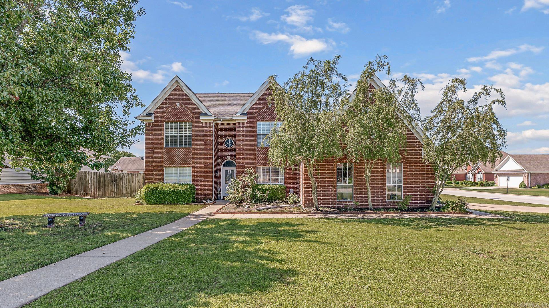 This 4-bedroom home blends timeless elegance with a spacious, functional layout. From the beautifully landscaped front yard to the classic mostly brick exterior, this home is warm and inviting. Step into the grand foyer with soaring ceilings, a catwalk overlook, and views into the formal dining room. Enjoy two separate living areas one just off the foyer, and the other featuring a cozy fireplace with direct access to the patios and fenced backyard. The main-floor primary suite includes large windows and an en-suite bathroom with an oversized walk-in shower, a corner soaking tub, and double vanities. The formal dining room has large windows and a chandelier, while the breakfast nook, with its charming bay windows, sits just off the kitchen. The kitchen features stainless steel appliances and convenient access to the garage, making everyday living effortless. A guest half bath and laundry room are also located on the main floor. Upstairs, there are three additional bedrooms and a full bathroom. The fourth bedroom located above the garage is extra spacious and versatile. Outside, the privacy fenced backyard is perfect with two patios and a fire pit. Call today to go see it!