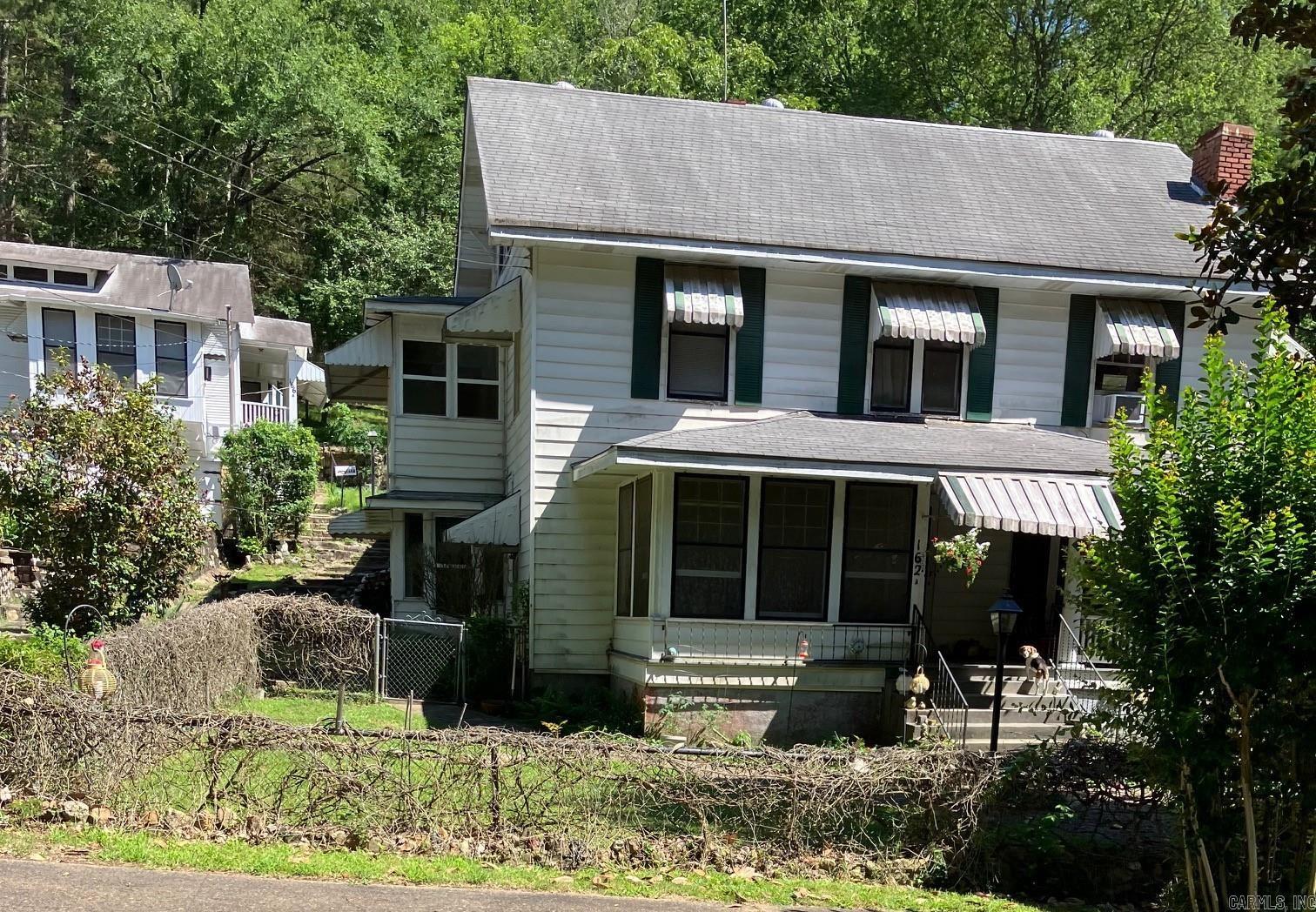 A Historic Travel Court in Uptown 7 buildings consisting of 10 rental units. 162,a,b,c Ramble St. as well as 166a,b,168,170, 172,176,178 Ramble St. There is a coin operated laundry on the property to accommodate units that do not have washer dryer hook ups. Current owner has owned for 37 years and taken great care in maintaining and preserving the property. Great occupancy rates and steady income stream with a good CAP rate. Owners have done many repairs during the ownership to keep the properties in good condition as well as maintaining the historic integrity when possible. For more detailed information on the maintenance and financials, contact the listing agent. The property backs up to Hot Springs National Park. About half of the 1 1/3 acres is behind the cottages and undeveloped. adding units is made easier with access and utilities behind the property on Craig Terrace. Close to parks, Northwoods bike trails, and walking distance downtown Hot Springs.