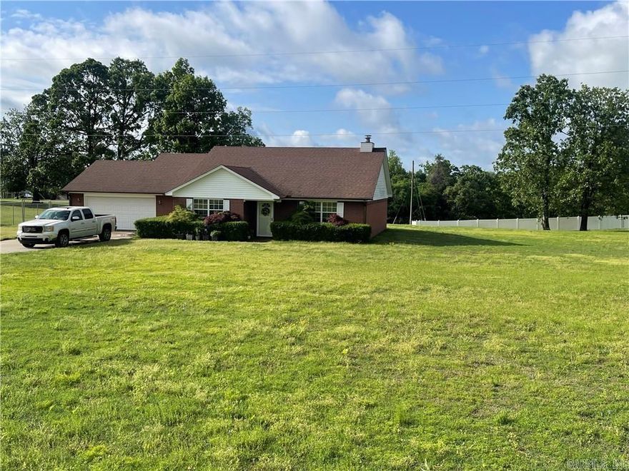 SERENE COUNTRY LIVING at its best! One owner, gorgeous brick dwelling has been well maintained and updated. Offers a winning combination of warmth, updates, and open floor plan. Massive family room has a vaulted ceiling with a majestic fireplace. Designer kitchen with granite countertops, island, and pantry. The prominent and remarkable brick pavilion provides a fantastic social arena for family and guests. Fenced lawn for canines and kids. Expensive sprinkler system covers the entire lawn-per seller. Additional lot at the back of the home. See MLS Remarks.