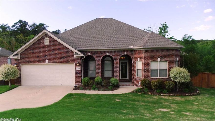 GREAT open 1 level home with lots of extras. Hardwood floors, granite counter tops, upgraded light fixtures, upgraded carpet, sprinkler system and extra storage under the home. Living rm has a beautiful fireplace plus it is already wired for surround sound. Large master br with trey ceiling. Master bath has double sinks, jetted tub, separate shower and the probably the largest master closets you will see in this price range. Front br or office. 2 more br with jack & jill bath. Great deck over looking trees