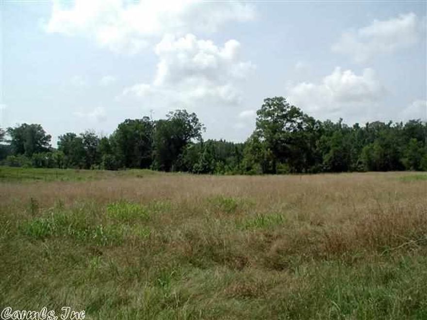16.52 nice acres with 4 acres +/- pasture, woods and a creek.  Almost completely fenced.  Land is round baled in season.  Convenient to Hot Springs or Glenwood.