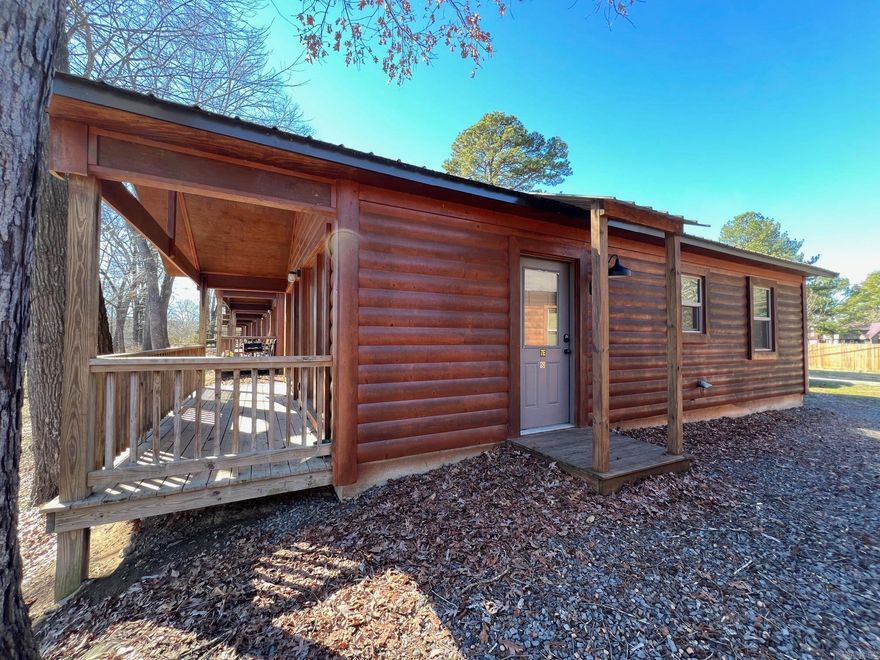 RIVERSIDE CABIN WITH BOAT SLIP!  Short term rentals OKAY!  About as perfect as investment property gets! Affordable, low maintenance cabin with ready-made clientele. Cozy riverfront cabin comes with a covered boat slip in community dock. Completely furnished, outfitted, ready to rent or personal use.  Beautiful natural cedar paneling, vaulted wood ceiling.  Walk-in access to one of the largest wadable fishing areas on the Little Red. Close to two restaurants, hiking trails on Sugarloaf Mtn, minutes from Greers Ferry Lake & shopping/services in Heber Springs. Housekeeping available. Community laundry & pavilion. AGENTS SEE REMARKS