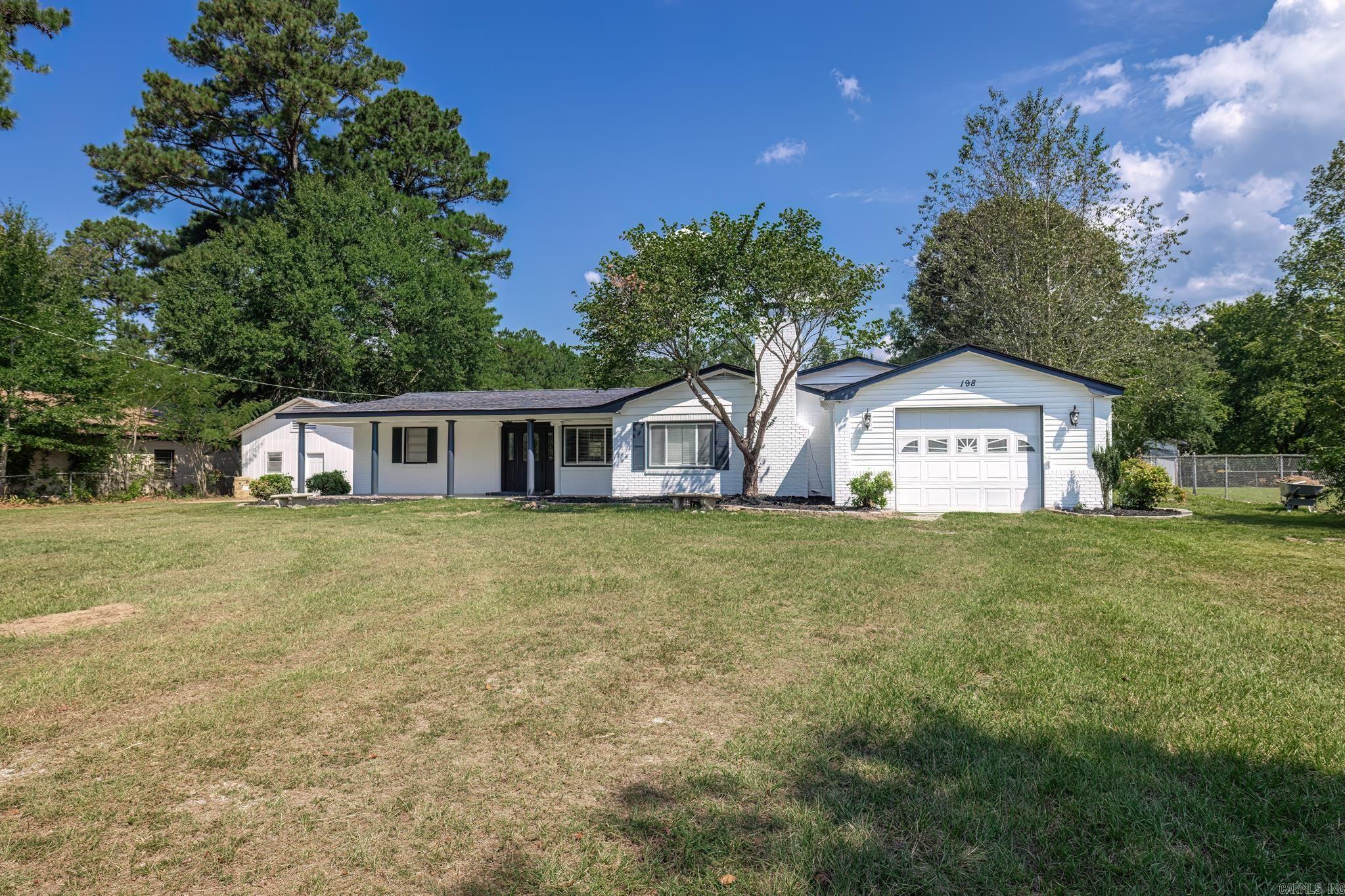 Nestled on a sprawling 3.79-acre property just a minute away from DeGray Lake and the Caddo River, this beautifully remodeled 4-bedroom, 2-bath home offers the perfect blend of modern comfort and serene country living. The interior features new luxury vinyl plank (LVP) flooring throughout, providing a seamless flow from room to room. The home boasts a huge den, ideal for entertaining or relaxing, and a massive master suite that serves as a true retreat. The master bath is equally impressive, featuring a large walk-in shower and a vanity area. In addition to the home, there is a spacious 20x82 shop on the property, perfect for storage, hobbies, or a workshop. This property offers both the tranquility of nature and the convenience of modern living, making it a rare find in such a prime location.