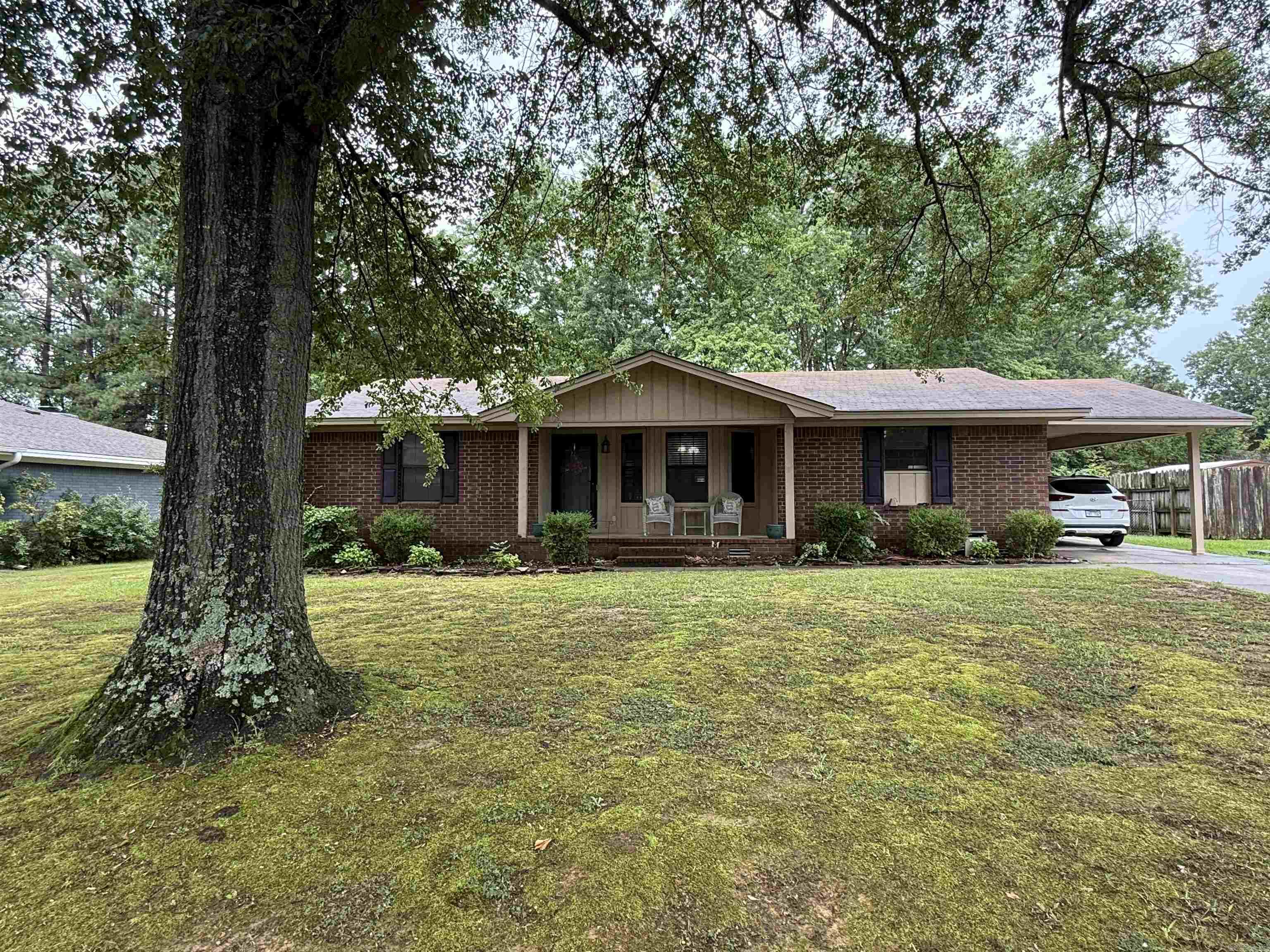 This well-maintained home features 3 spacious bedrooms and 2 full bathrooms, ideal for families or those needing extra space. Recent updates include a brand new water heater, roof replaced in 2018, and HVAC system in 2017. The living room, dining area, and kitchen boast beautiful new tile flooring. Outside, enjoy a large fenced-in backyard with mature trees providing shade and privacy, a covered back patio perfect for relaxing or entertaining, and a shop/outdoor storage building for added convenience. Move-in ready and full of charmāschedule your showing today!