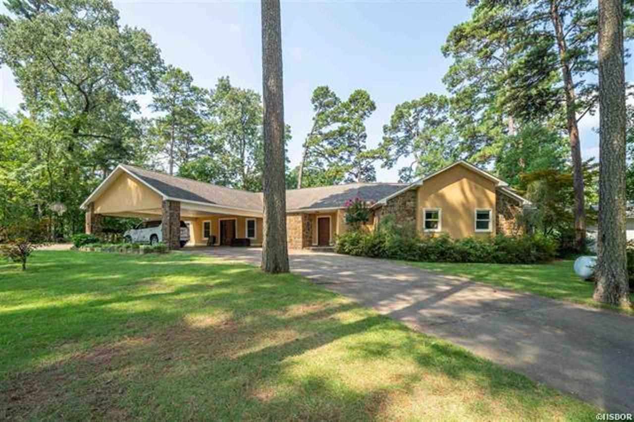 Waterfront home all on one level! 5 bedrooms, 4.5 baths, covered boat dock with lift, gated driveway with circle drive. 2009 addition designed by David French Architect! Brazilian walnut floors in kitchen, family room and hall. Open kitchen with breakfast bar, big laundry room, fully fenced yard! Fun house to live in and entertain, huge covered deck, incredible views of lake and mountains. Generator, sprinkler system in front yard.