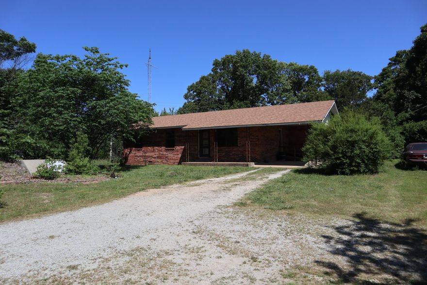 OZARKS COUNTRY HOME & ACRES FOR SALE NEAR VIOLA ARKANSAS  Property is located at 3863 Browns Chapel Rd, Viola, AR. This 3 bedroom, 1 bath brick home sits on approx. 26.66 acres just minutes from Viola. The house has a single carport, central heat & air, range, refrigerator, washer & dryer. It has a private well and septic system. Also includes propane tank. Large shaded yard with a garden area, fruit trees and storm shelter. The house is dated and will need updates. The land is divided into to separate tracts. The home sits on a 13.33 acre tract and there is another 13.33 acre tract included. NOTE: There is a 13.33 acre tract that is located in between the tracts. It is listed for sale by another owner. All three tracts must be purchased together for a closing. There is also an older barn and 2 ponds. There are a few overgrown fields with the balance in woods with mature oaks. Abundance of wildlife including deer. Property is sold AS IS. Located within 30-45 minutes of Lake Norfork and the world famous White River. Previous years taxes were $464.39. Great location approx. 1/4 mile off of pavement with county road frontage. THE SALE IS SUBJECT TO COURT APPROVAL