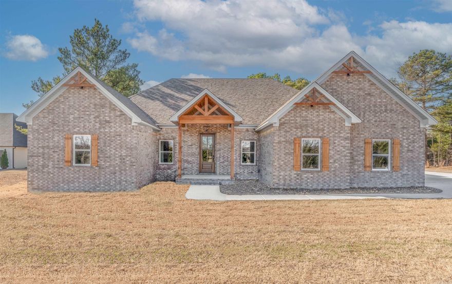 Come check out this BEAUTIFUL NEW CONSTRUCTION in Coyote Ridge sub on a 1 acre lot. Open floor plan, Fireplace with shiplap, Granite on the large kitchen island along with both bathrooms, LV Flooring, Laundry has LOTS of cabinets, Primary bathroom has double sinks, makeup counter, Walk in tiled shower with bench, Primary bedroom has tray ceiling and a FABULOUS walk in closet with shelving. There is storage in the floored attic above the side loading garage. Enjoy this brick home with a private back yard and relax  on the back covered porch.  Taxes are est only on lot. Give me a call and come check out this home.