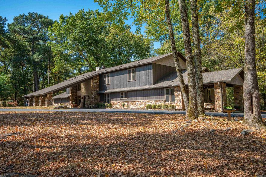 Country Retreat on 5+ acres! Discover your own private oasis in this lovely 7-bedroom, 4.5-bathroom home nestled on 5 acres of park-like grounds. With rustic charm and modern amenities, this home offers the perfect blend of comfort and style. Two master suites, one on each level. Total of two bedrooms down and five up. Two car carport and 3 car detached 30X40 garage with auto door openers. 50 amp RV plug in in garage. One covered patio & one uncovered. New architectural shingle roof in 2022. Three central heat & air units with natural gas heat. Site built stone fireplace currently used with gas logs. 12X20 storage building with lean-to on each side. A very unique custom built home.