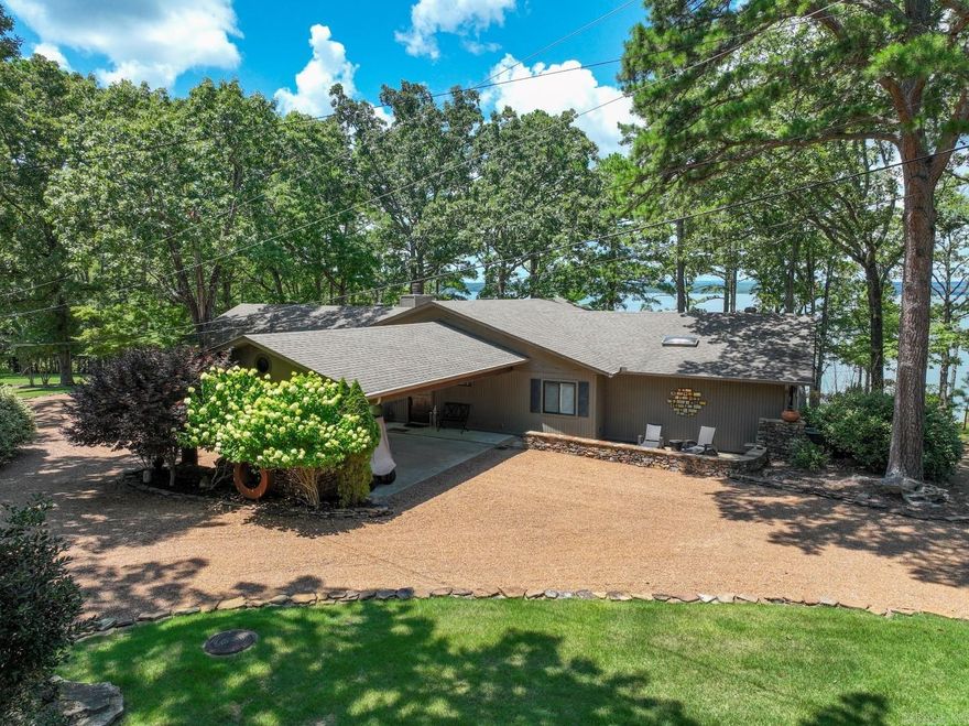 Eden Isle Lakefront home with an excellent view of Greers Ferry Lake!  4-bedroom, 4-baths, lots of updates, 1-level home, 2-car carport, large covered back deck, stone fireplace and walls of glass on the lake side of the home.  A lovely, well-cared-for property!