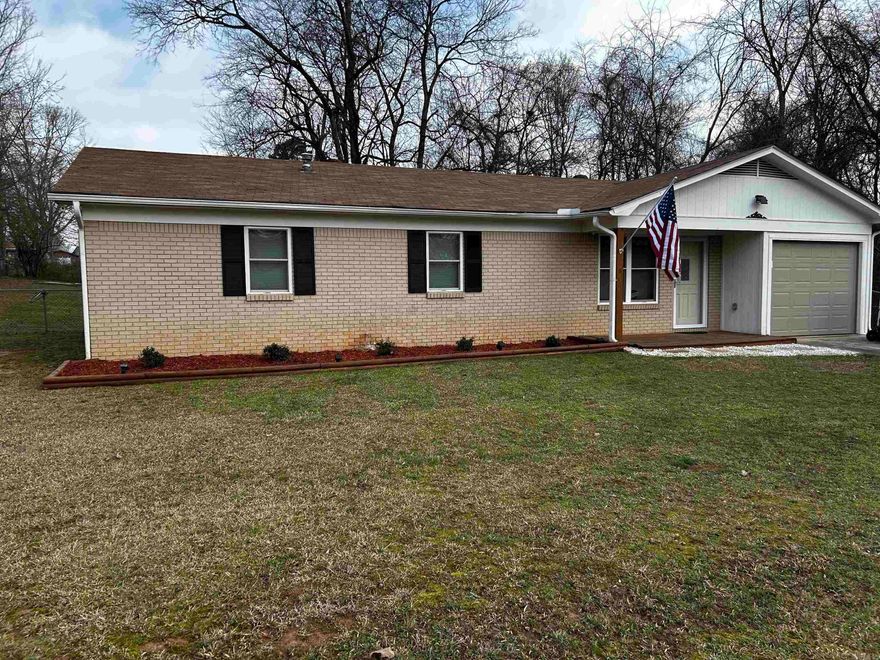 Here is your chance to own a well maintained home with tons of curb appeal in the tranquil Pebble Lake subdivision of Benton. The 3 bed/ 2 bath house sits on an almost half acre sized lot with fully fenced in backyard, complete with storage building for whatever you need to store. Brand new gas range, microwave, and dishwasher convey with property, as well as fridge. Laminate flooring in every room throughout house except where there is tile (laundry room, primary bathroom, pantry) and carpet (two guest bedrooms). Seller will be having two guest bedrooms recarpeted before close. Deck/ porch areas have been freshly painted, water heater was replaced in 2024, and roof was replaced in 2016. A heated one car garage is perfect for storing a car, boat, ATVs, or would make a perfect home gym or studio. Was most recently used as home gym. Bryant school bus stops a couple hundred yards down every morning and afternoon!