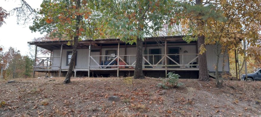 Fixer Upper or Bring in Your Own!    Nestled at the top of a peaceful hill, this mobile home sits on acreage that is the perfect blend of privacy and convenience. With expansive acreage surrounding the property, you can enjoy the tranquility of country living while being just a short drive away from the amenities of Hot Springs and Hot Springs Village.   Whether you're seeking a private retreat, a place to call home, or a weekend getaway, this property delivers both serenity and access to everything you need.