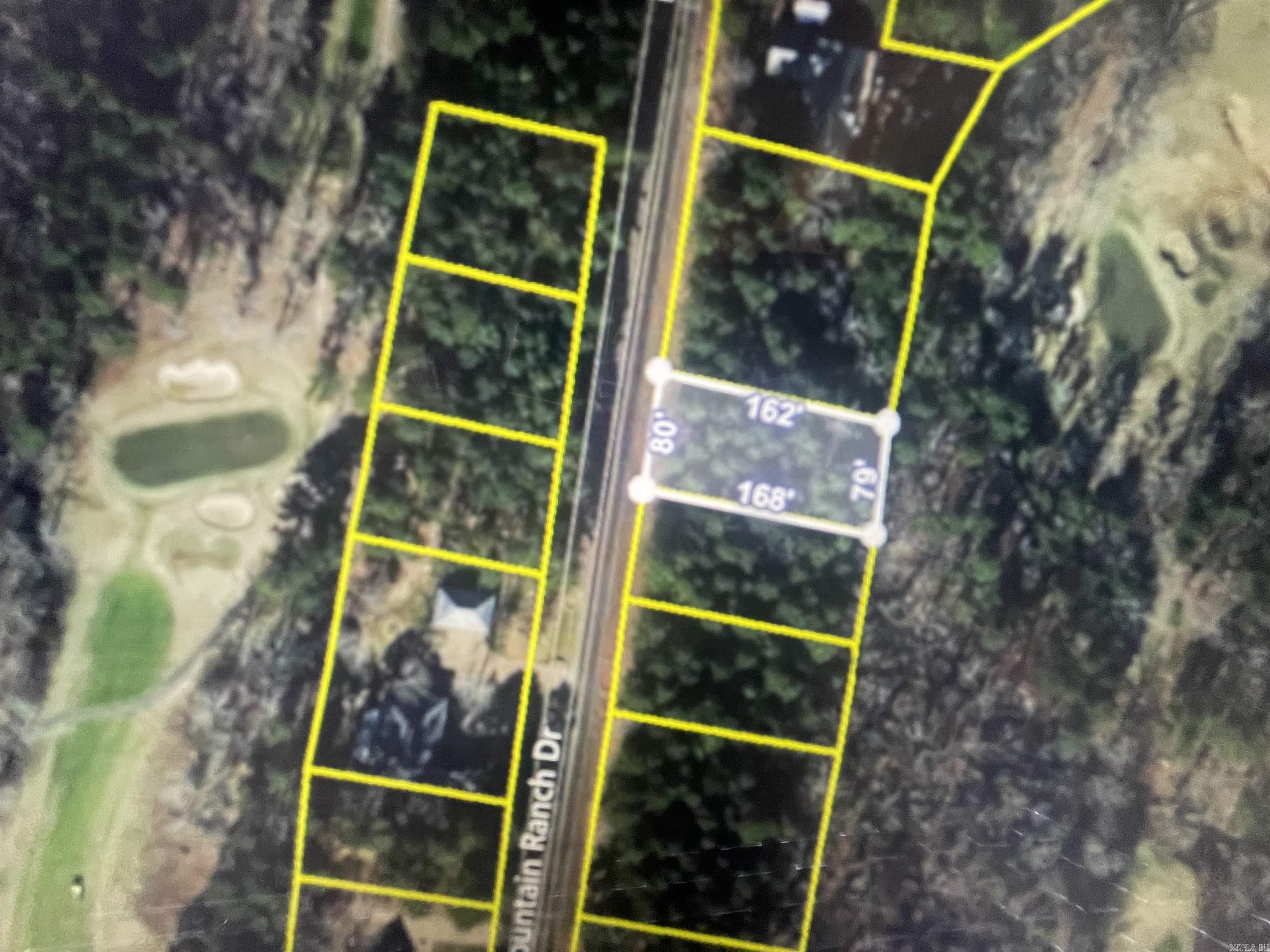 Come build your dream home today on the golf course frontage lot. Enjoy living in Fairfield Bay, where every day feels like a vacation! Nestled amidst the picturesque landscapes of the Mountain Ranch Golf Course, this area offers you the perfect blend of relaxation & adventure. With this prime location, you can indulge in your passion for golf anytime you desire. Tee off during the day & as the sun sets, bask in the breathtaking views of the shimmering lake nearby. This is the epitome of tranquil living at its finest. But that's not all! Fairfield Bay boasts a plethora of amenities to enrich your life. Within minutes of your new abode, you'll find a full-service marina, beckoning you to embark on aquatic adventures whenever the mood strikes. Dive into the refreshing waters of one of the three swimming pools, or challenge your friends to a game of tennis or pickleball. Feel the thrill of exploration as you traverse the hiking & biking trails, or opt for a leisurely round of miniature golf or disc golf. With over 80 miles of UTV trails at your disposal, the possibilities for outdoor recreation are endless. Buyer to pay all closing costs and title insurance.