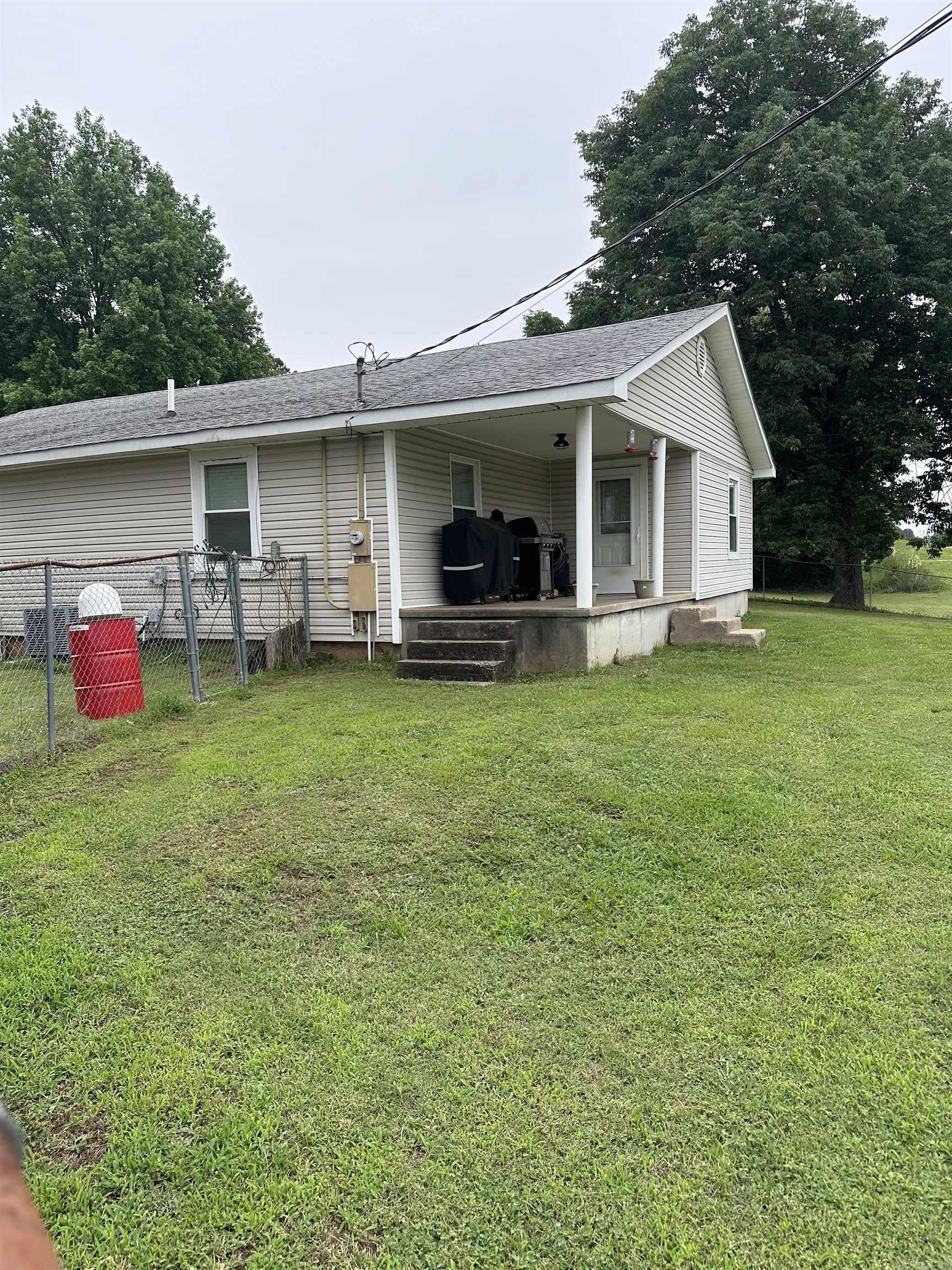 This property has two homes located on it sitting on 4.09 acres assessed under the same parcel! The first home at 9850 Hwy 412 W offers 3 beds 1.5 baths, 1,280 sq/ft, remodeled in 2018 and the roof is approximately 8 years old. The second home at 9933 Hwy 412 W offers 2 beds and 2 baths, 1,196 sq/ft and the roof is approximately 2-3 years old. Both homes offer gas stoves and have central AC. There is a 40x40 camper shed with electric, 28x50 shop with electric and water (water not currently turned on) inside this shop there is a small kitchen, toilet and laundry area, 30x30 shed with electric, and a barn with three stalls.