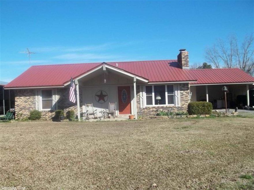 Rural residential. Down payment rolled into loan.  2 Bedrooms, 2 baths, sun room (could be used as another bedroom) OR slab in back could always add another room. OR enclose one or both of the carports and add another room. Lots of possibilities. Tile flooring throughout. Large laundry room. All electric. Gas stove (propane). Wood burning fireplace insert. 1680 Sq. Ft. Built 1979. Taxes $284.69 w/tax credit. RV parking or convert into a workshop/storage.