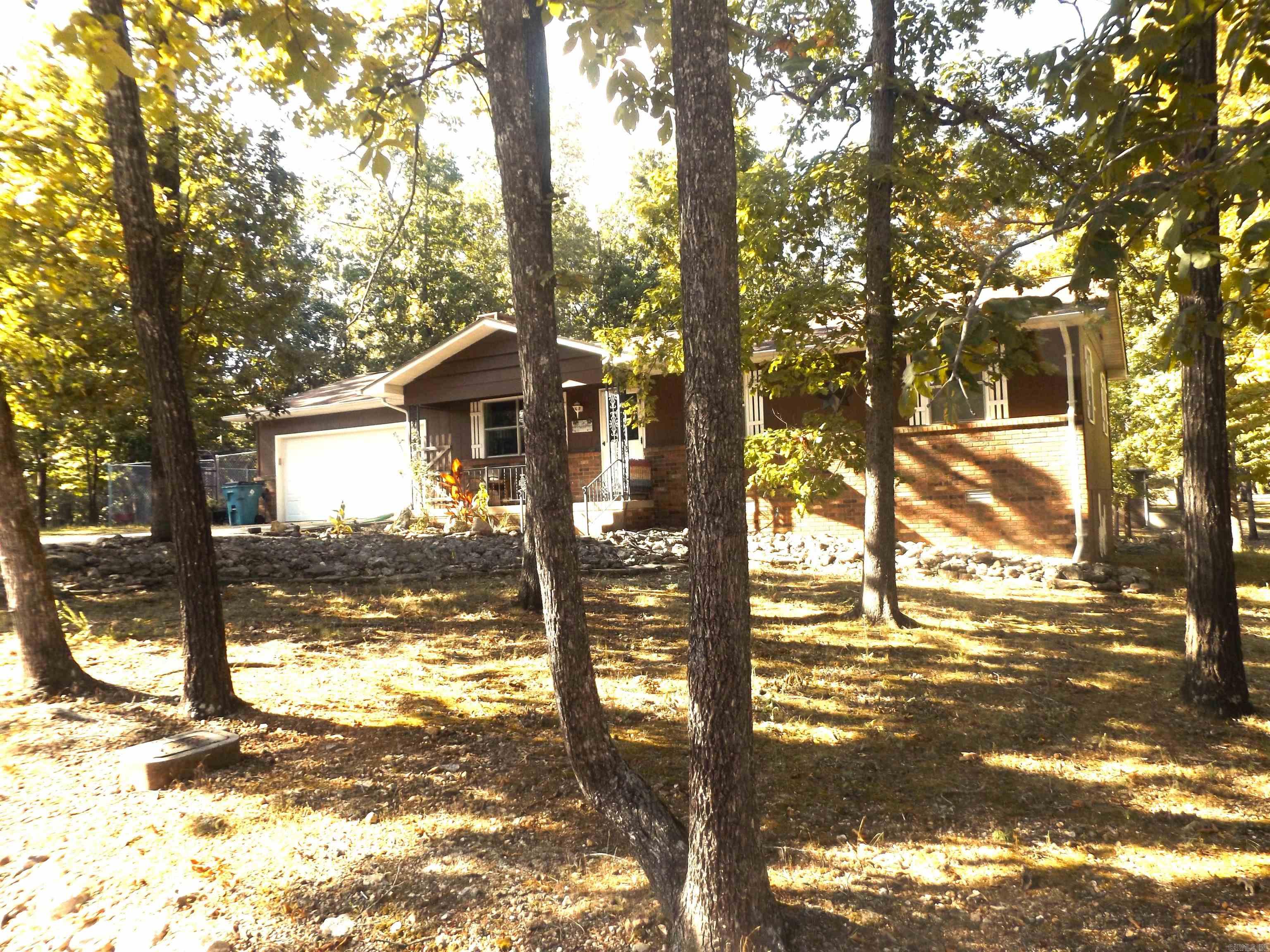 This amazing 3-bed/2-bath home recently underwent an incredible remodel! Featuring solid white oak wood flooring throughout the home. All new custom white oak cabinetry in the kitchen, along with new countertops and appliances. The guest bathroom received a new porcelain tile floor, and the master bath was totally remodeled! There is an all-seasons sunroom and a screened-in porch to enjoy your backyard. For the gardener in your family, a fenced-in raised garden area. For the craftsman, a built-in workshop in the garage! If that is not enough, the home is located just minutes from the marina! This makes the perfect move-in-ready retirement home!