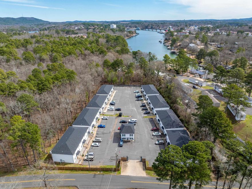 Looking for a premiere investment property?  We found it! Majestic Townhomes is a 41 unit multi-family, gated community containing 40 2 bedroom and 2.5 bath units and one 2 bedroom 1 bath flat.  21 of the units were completely remodeled in 2020.  Another 20 units were built in 2021!  This development is located in the heart of the Lake Hamilton School District and is convenient to shopping, restaurants, medical facilities and public lake access to the shores of Lake Hamilton.