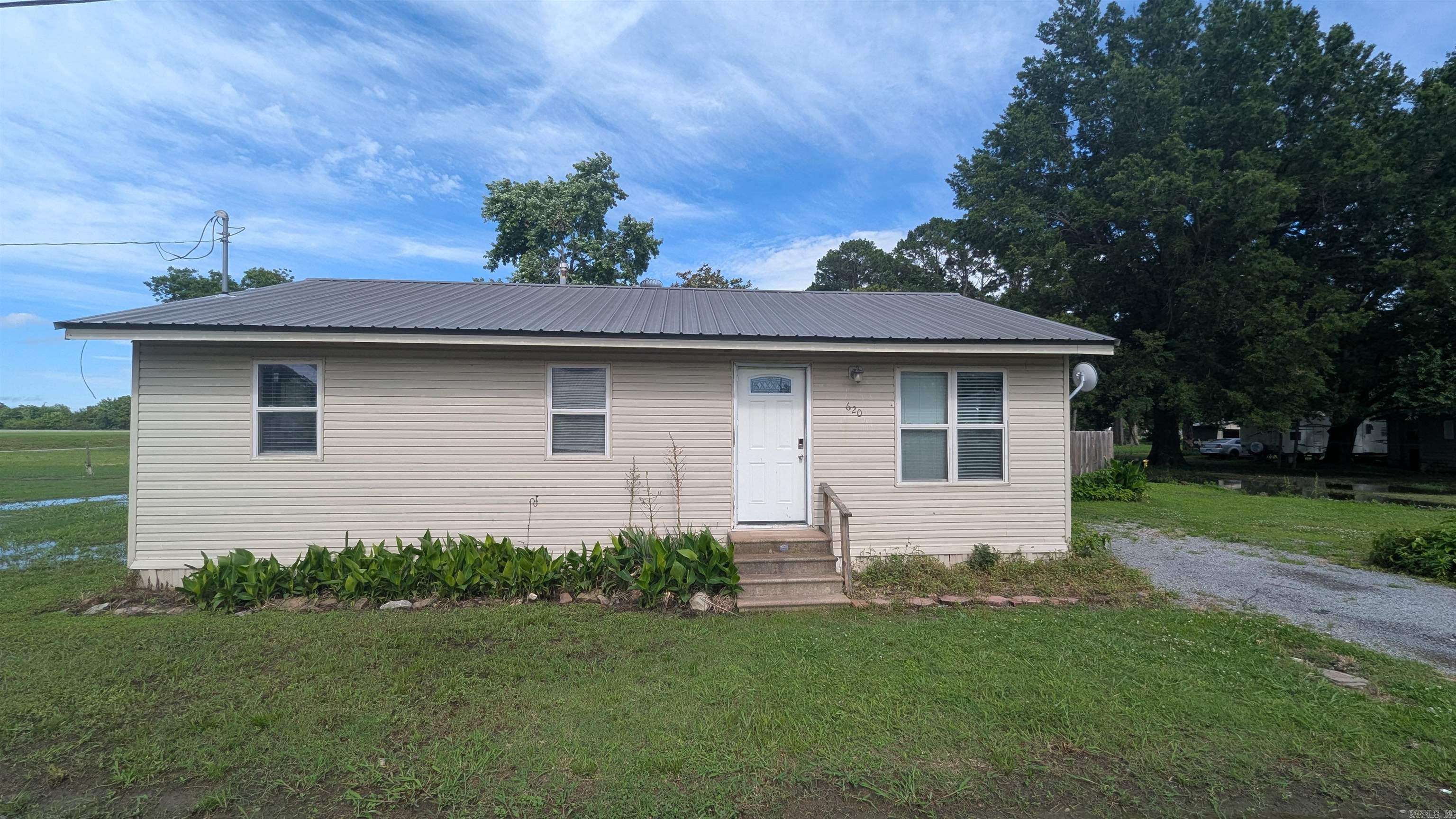 Welcome home to this charming 3-bedroom, 1-bath property in Grubbs, move-in ready and packed with value! Ideal for first-time buyers, downsizers, or investors, this home offers a spacious layout with comfortable living areas and the potential to serve as a cozy hunting lodge or a rental property. Recent updates include new gas lines installed in 2025, a 50-gallon water heater in 2020, and siding, windows, HVAC, and plumbing modernized in 2002. For added peace of mind, the home features added gas wall heat for emergencies. Outside, enjoy a fully fenced-in backyard with a wood privacy fence, perfect for pets or play, along with an 8x10 storage/workshop for extra convenience. Remember Don't Buy Or Sell Alone!