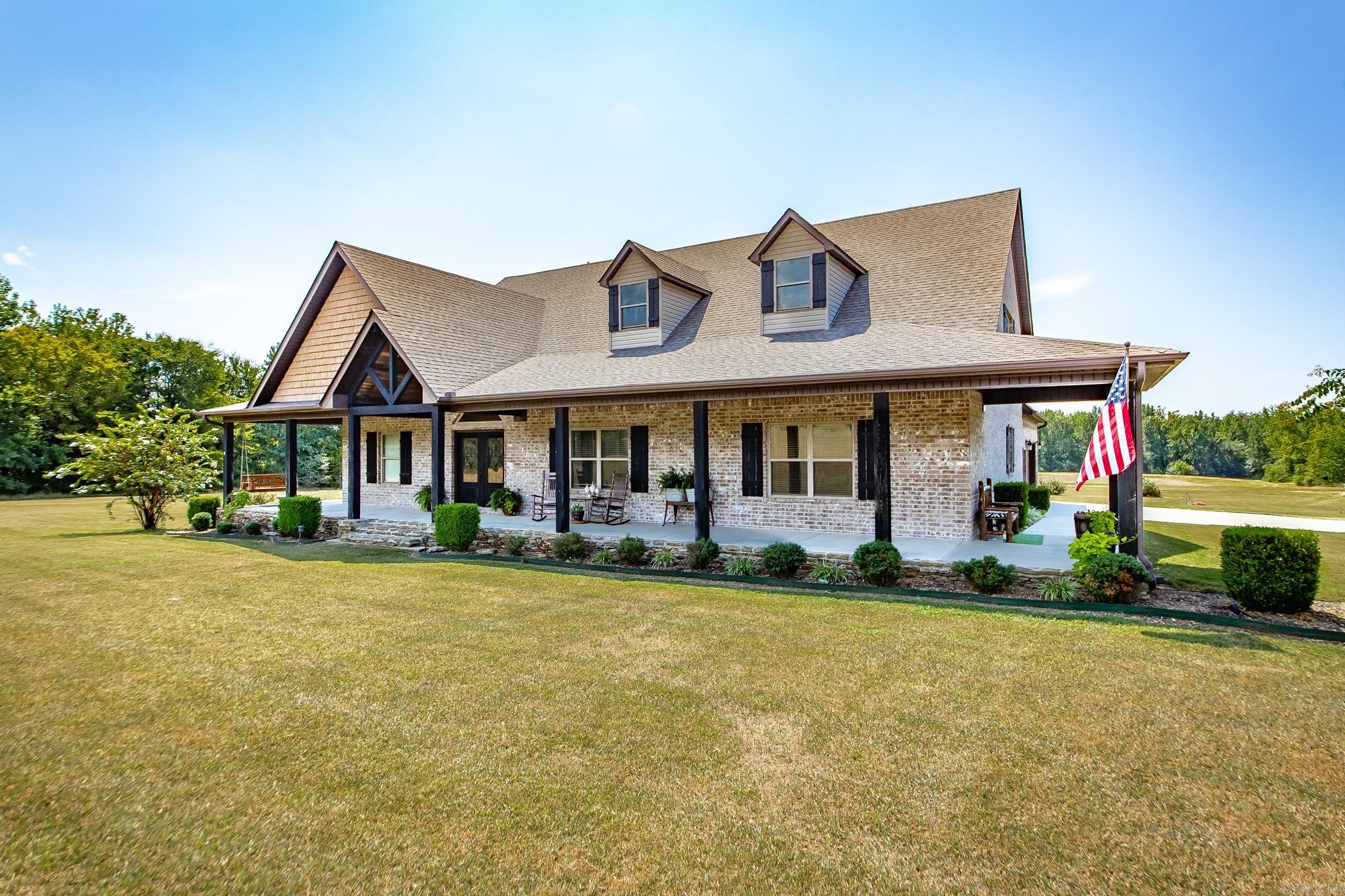 Antioch Area! Luxurious 2940 sq ft 4/3-bedroom home situated on 13 acres with a two-acre pond. The open floor plan of this home enables everyone to participate in conversations and celebrations. The floor-to-ceiling fireplace sets the tone for festive holiday entertaining or cozy family moments. Home showcases a standalone office tailored for those needing a private workspace. Desiring storm safety? This home has a steel walk-in safety room located within the garage. The 40x50 shop with 14 ft sidewalls has its own office, bathroom and tool storage room. Wired alone for 220 for those needing extra amps for welding etc... The spacious desk is perfect for BBQ's or relaxing with family and friends while enjoying the scenic views of the field and pond. Call today! See Agent Remarks!