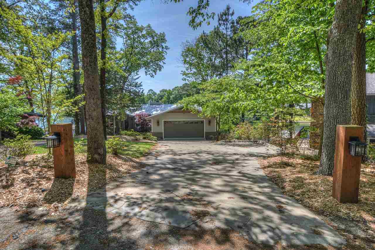 Ever-changing vistas are yours from this waterfront home in Tanglewood Estates.  This home has the perfect location and perfect setting for enjoying life on Lake Hamilton.  It features a beautiful backyard setting with an oversized deck that extends the full length of the home, offering a great place to extend the outdoor entertainment.  The home features a complete remodel, gorgeous landscaping, and fantastic new double boat dock.