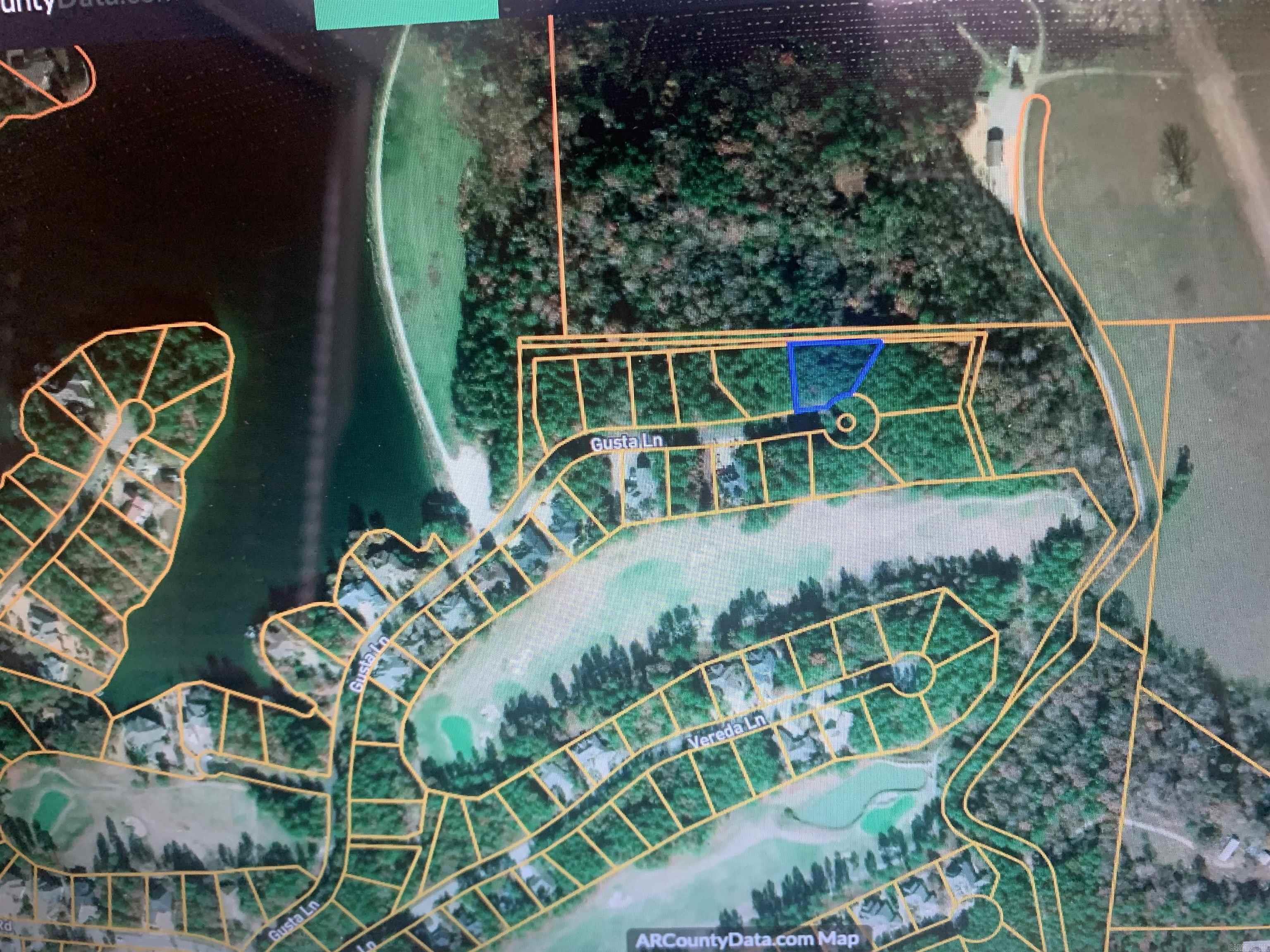 If you are looking for a location with privacy, yet close to amenities, this may be the right lot for you. This lot is walking distance to the Granada boat ramp and easy golf cart ride to several golf courses. This lot is fairly large at .47 acre. It is across from Granada Golf Course Frontage Homes and backs up to over 80 acres of Private Farm Land. Adding extra privacy and Views! Easy golf cart ride to several golf courses. The street is lined with newer homes. Picture 4 and 5 are Lake Granada just steps from the property. Pictures 6-20 are of the Community.