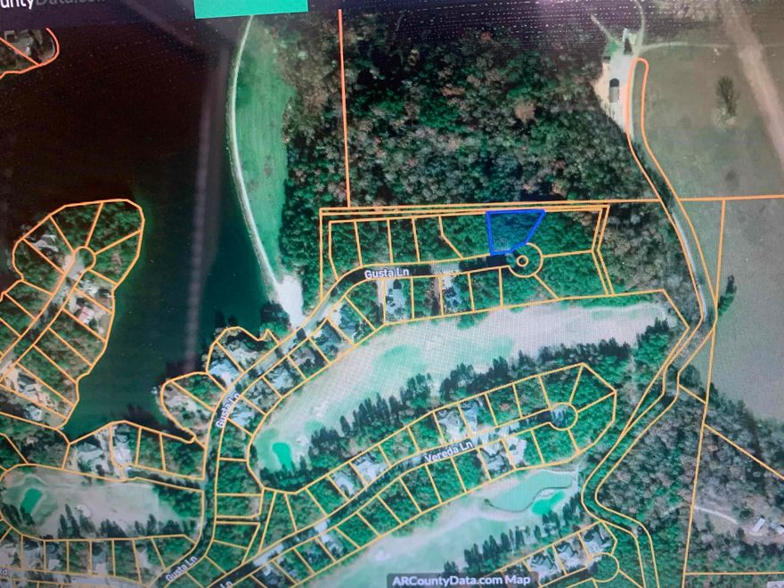 If you are looking for a location with privacy, yet close to amenities, this may be the right lot for you. This lot is walking distance to the Granada boat ramp and easy golf cart ride to several golf courses. This lot is fairly large at .47 acre. It is across from Granada Golf Course Frontage Homes and backs up to over 80 acres of Private Farm Land.  Adding extra privacy and Views!     Easy golf cart ride to several golf courses. The street is lined with newer homes.  Picture 4 and 5 are Lake Granada just steps from the property.  Pictures 6-20 are of the Community.