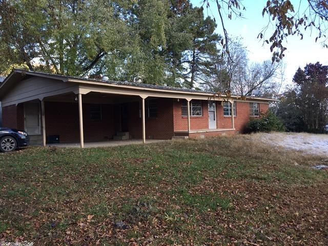 Brick home on the corner of Main St. & Walnut in the heart of Pangburn on a little less than an acre lot (.96 acres). A total of 6 lots combined that will convey with the home. House needs some work but definitely has a lot of potential. 420sq.f. utility storage building behind the home.