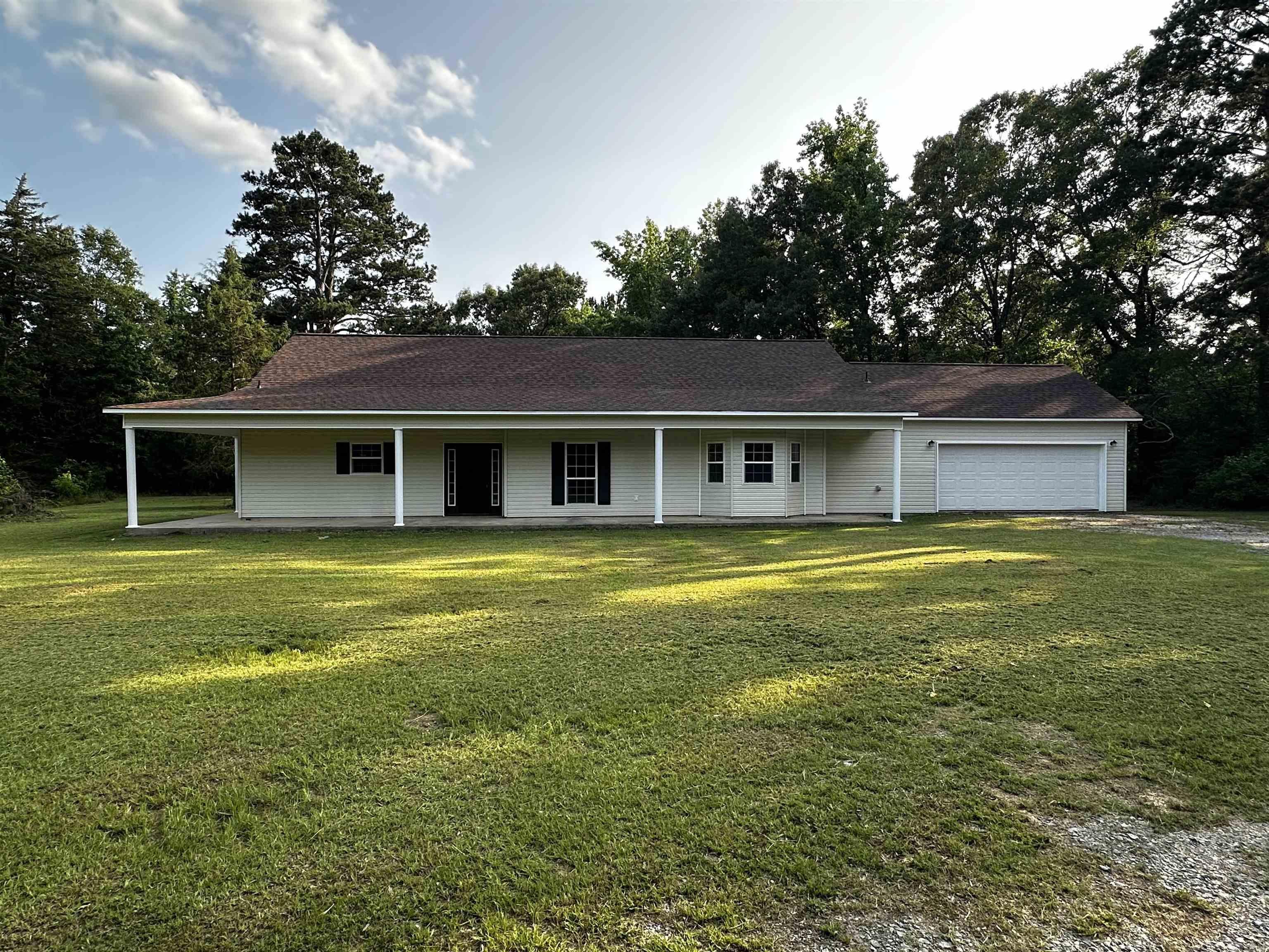 Completely Remodeled Home on 11.84 acres in Bradley County. Discover this beautifully renovated home located just 7 miles north of Warren, offering modern upgrades and spacious living on 11.84 acres. Featuring brand new black stainless appliances, new architectural shingles, vinyl plank flooring, and a new hot water heater, this home is move-in ready. Enjoy the luxury of large rooms, two car garage, and includes a spacious laundry room, and custom walk-in showers for a spa-like experience. The home provides comfort, style, and privacy with plenty of room to roam both indoors and out.