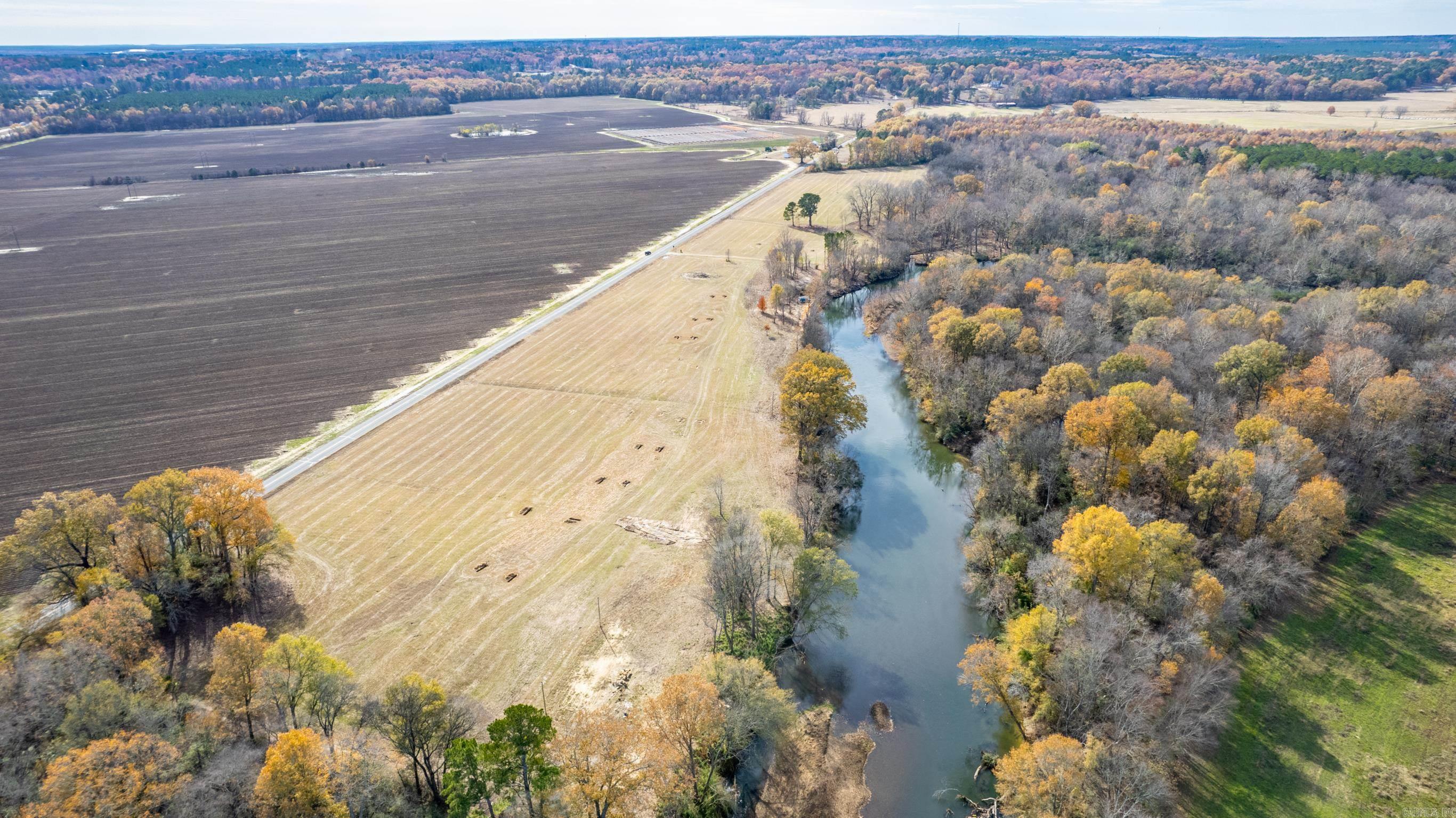 Lot 4 in Caddo Paddock Subdivision has deeded walking access to the Caddo River. Paved county road access along Old Military Road, municipal water, permitted septic, underground electricity, fiber internet, and deed restrictions serve to protect value as well as enjoyment of the property. Restaurants, float outfitters, and I-30 are less than 1 mile away with Arkadelphia being only 5 miles south. The property has a unique history and is ideal for VRBO investment.