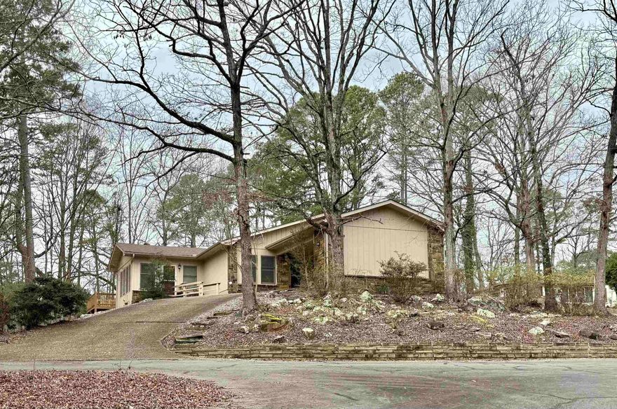 LOCATION! HOT SPRINGS VILLAGE!! Stunning 4-Bed 2-Bath home located in the heart of beautiful Hot Springs Village. This spacious home is a perfect blend of modern comforts & outdoor living and plenty of parking with a large circular driveway. The generous living room is perfect for family gatherings & flows effortlessly into the rest of the home. The expansive sun room is perfect for enjoying natural light with its large windows, providing an ideal spot to relax or entertain. You will love all the natural light it has to offer. It also boasts an amazing Jen-Air indoor grill. For those with a hobby or need for additional storage, an approximate 5x20 shop with electricity awaits. This home has been upgraded with lots of new items including: 2015 back deck, 2023 flooring, 2024 roof, paint, 2 HVAC units, gutters, water heater, skylights & extra landscaping. You’ll love being nestled in a peaceful cul-de-sac. Enjoy the best of Hot Springs Village with access to golf courses, lakes, pools, playgrounds, multiple hiking trails, shops & much more. A place where you can truly live the life you’ve always dreamed. Don’t miss a chance to call this amazing property your home! MOTIVATED SELLER!!