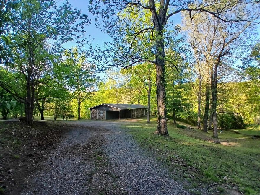 PRICE DROP!!  Charming 4-bedroom, 2-bath home located at 802 Casey St in Leslie, Arkansas, offers 1,569 +/- sq ft of cozy living space on a approximately 3/4-acre lot with mountain views. Built in 1975 with durable stone construction, this residence features a semi-open living area with a wood-burning fireplace, a modern kitchen with ample cabinetry, and versatile dining options. All four bedrooms are conveniently located on one level for easy access. The sloped, wooded lot adds charm and privacy, while the combination of gravel and paved roads ensures convenient access. Enjoy radiant heat, laminate flooring, a carport, and public sewer and water. Just minutes from downtown Leslie, this home provides a perfect blend of comfort and natural beauty, surrounded by the tranquility of the Ozarks. Ideal for a family residence or peaceful retreat, this property invites you to embrace Arkansas living.