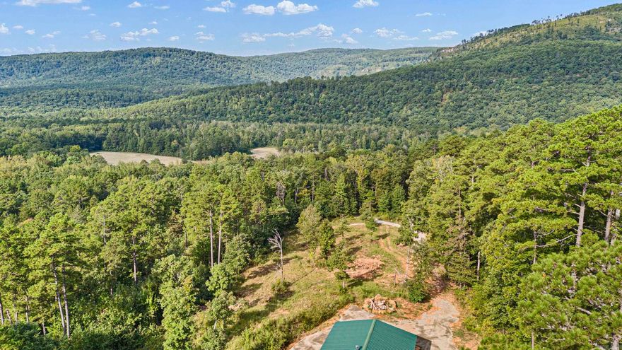 An AMAZING view and borders OZARK NATIONAL FORREST. Nestled along Highway?123 this property offers a rare blend of wilderness solitude and recreational access. Imagine sitting around a large campfire with friends and family as you enjoy the view over forested valleys and toward nearby creek corridors. Encompassing roughly 8 acres of mixed woods including mature hardwoods and tall pine, the land provides both seclusion and showpiece potential. With Little Piney Creek-Union School and Pilot Rock trails up the road, its a recreational playground for off-road vehicles, trail riding, hunting, or exploring. With a 30X40 1200 sqft building onsite, this allows you the opportunity to create a weekend retreat or a nature-minded homeplace. Give me a call and schedule your private tour today.